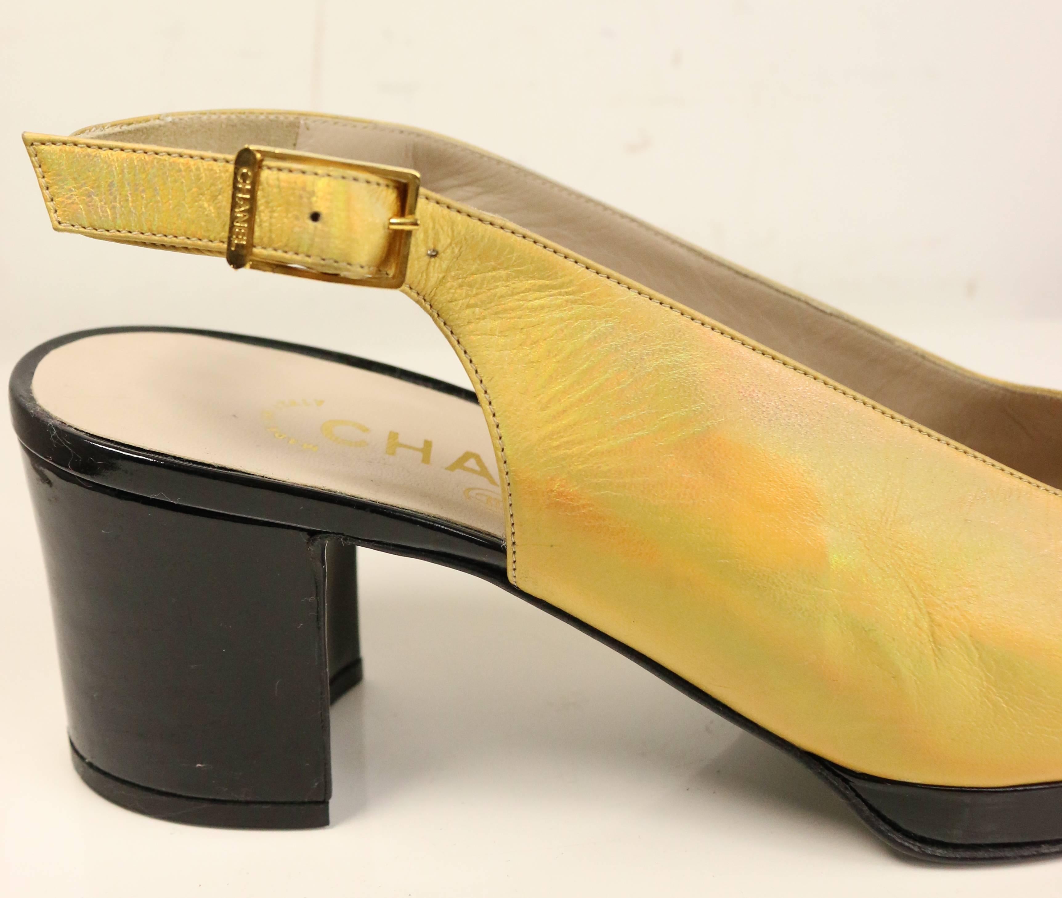 - Vintage 90s Chanel bi tone metallic gold with black patent leather square toe Mary Jane slingback shoes. This is a classic Coco Chanel style, elegant and chic summer shoes. 

- Size 37.5. 

- Made in Italy.

- Comes with dust bag. 

- Condition: