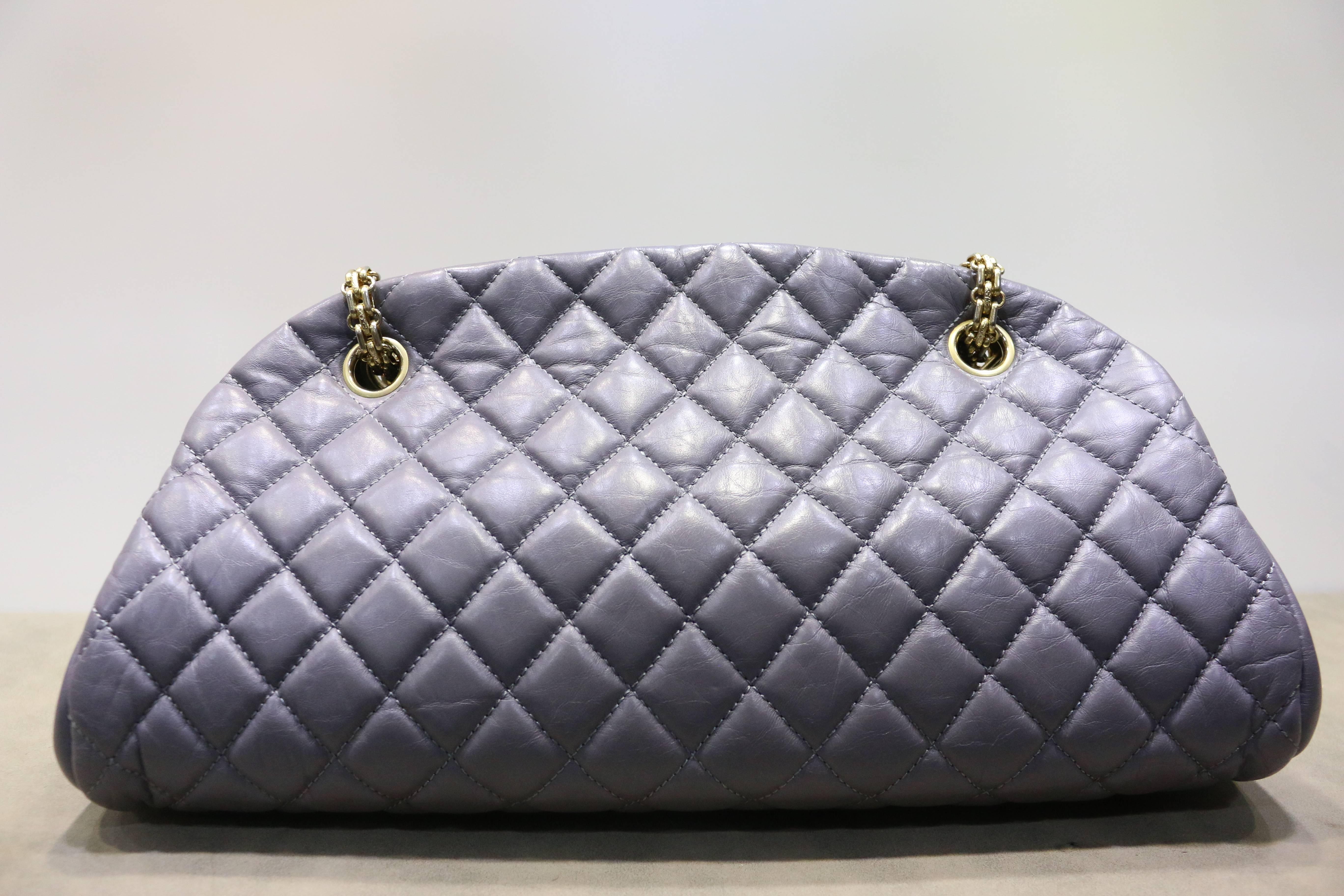 - This Chanel grey quilted lambskin leather bowling bag with gold chain strap is chic and stylist and in excellent preowned condition. It can be a highlight of your outfit with the shiny gold chain strap with "CC" charm attached to it.