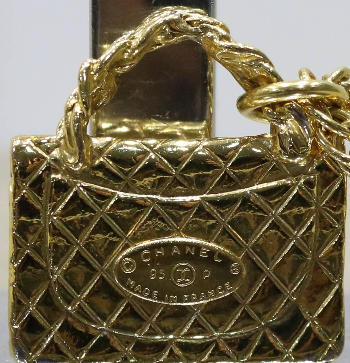 - Chanel gold toned classic quilted flap bag charm pendant necklace from 1995 collection. Featuring a gold toned strand link effect chain with clasp fastening. This is a truly vintage collectible item especially with such a cute little classic