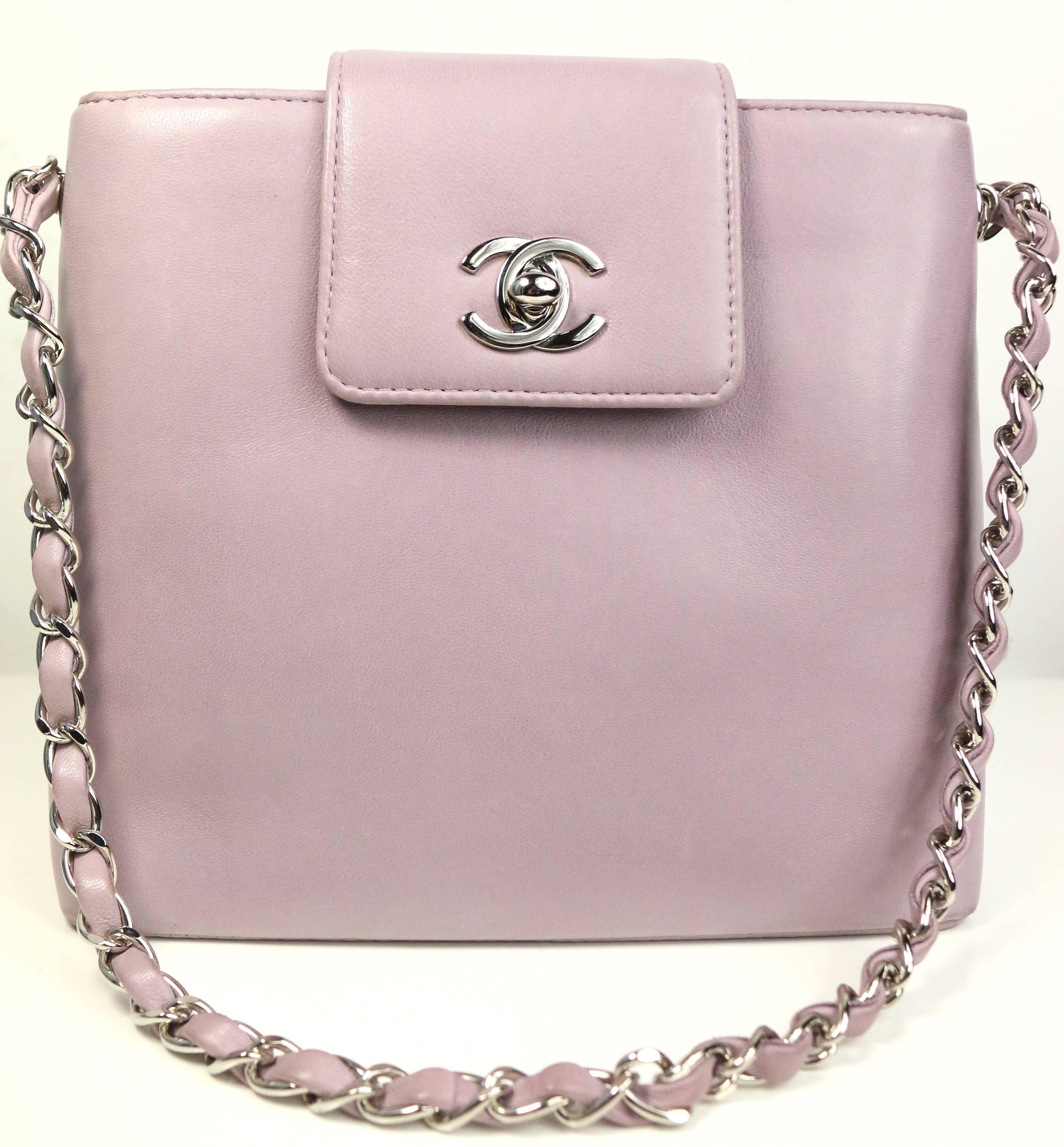 - Vintage 90s Chanel light purple lambskin leather with silver chain mini handbag. This bag is cute with great colour, featuring a little flap silver "CC" turn lock closure. An open pocket at the  back with one interior open pocket and one