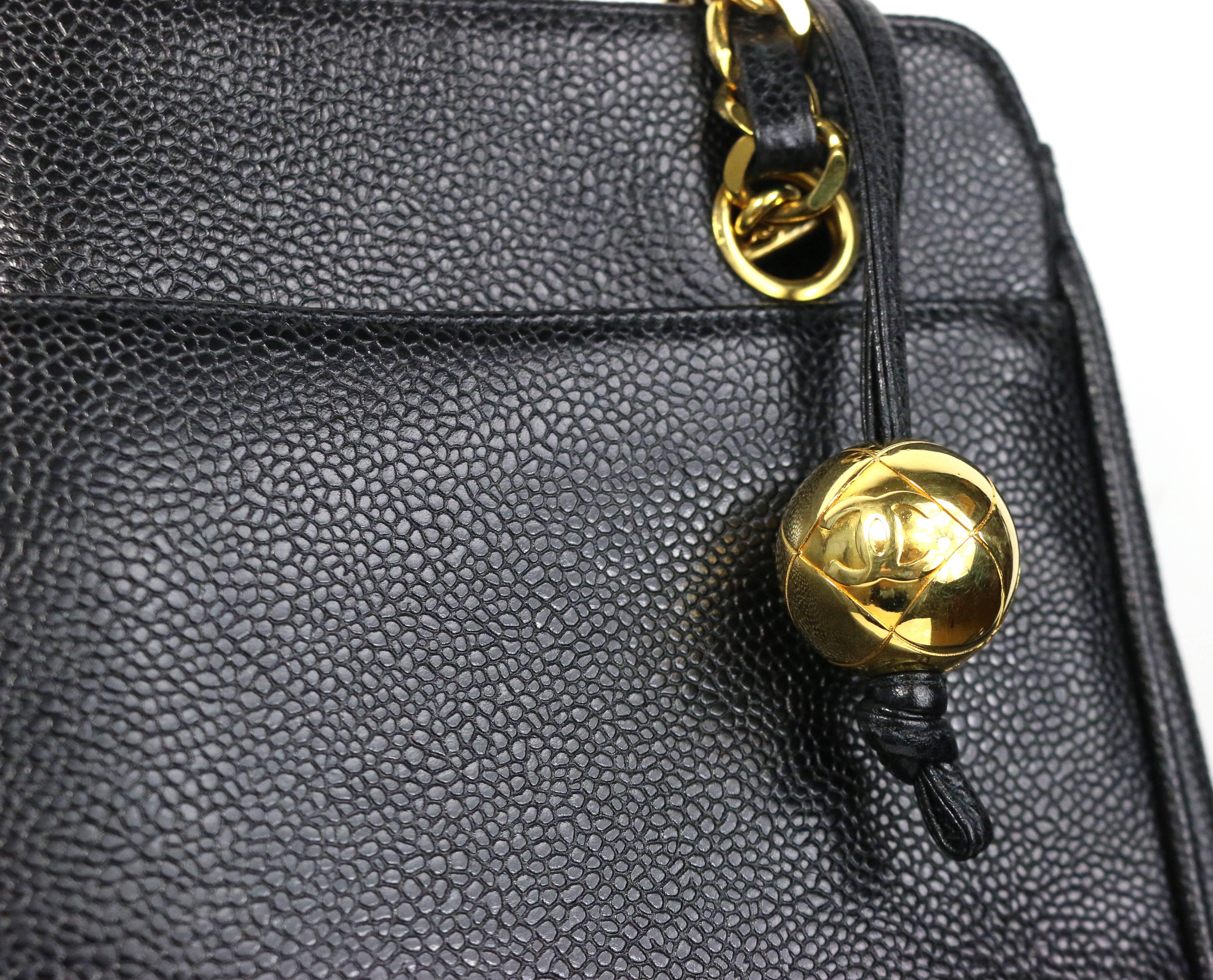 - Vintage 90s Chanel black caviar leather  gold chain shoulder bag. Its one of the Chanel classic bag in the 90s. 

- Front and back gold toned 