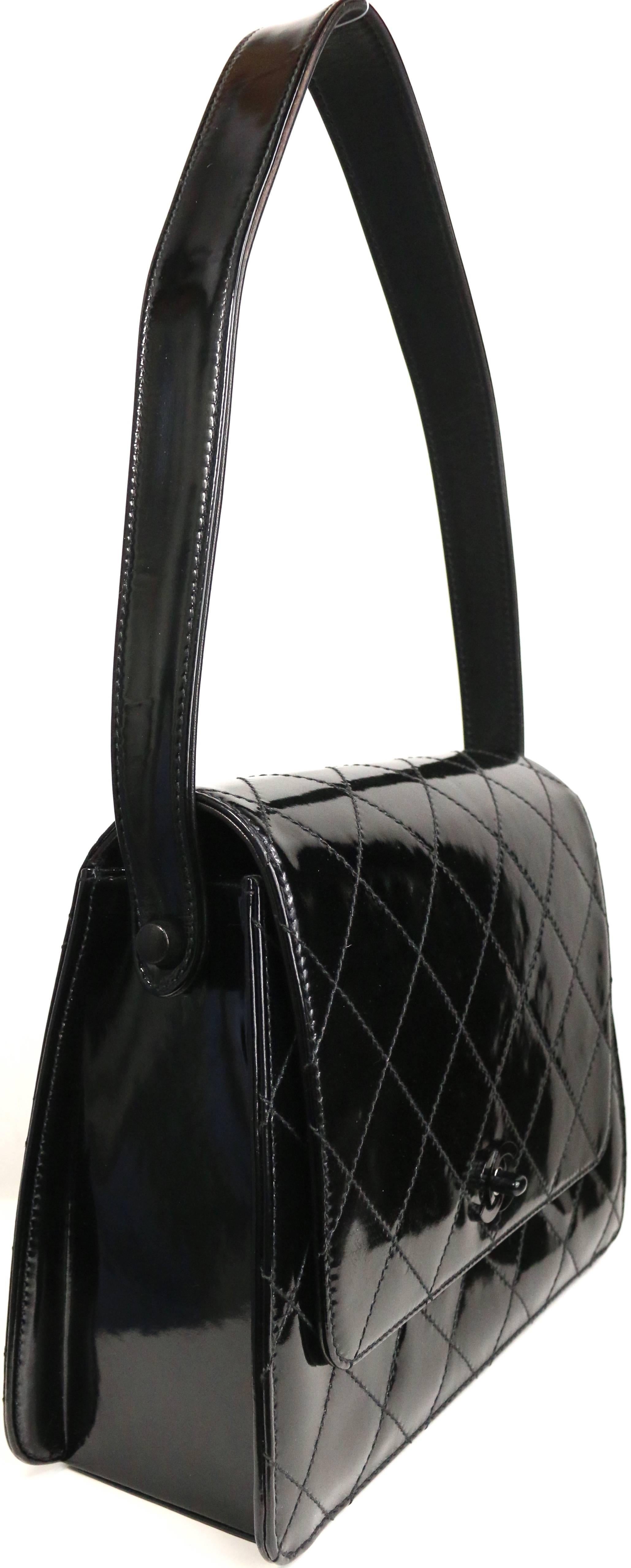 - Vintage 90s Chanel black quilted patent leather handbag. 

- Black 