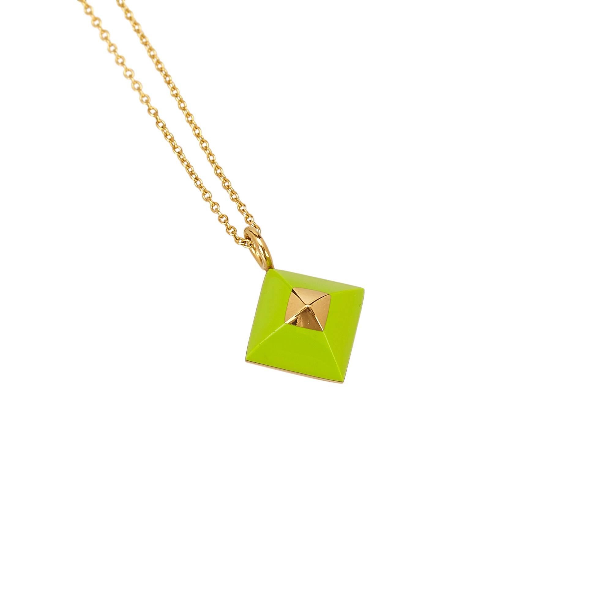 - This green Hermes necklace features a pyramid pendant, gold-tone chain necklace, and a spring ring closure. Nice colour and fashionable Hermes  necklace is great for summer wear. 

- Made in France. 

- Size: 1.6cm x 1.6cm. 

- Circumference: