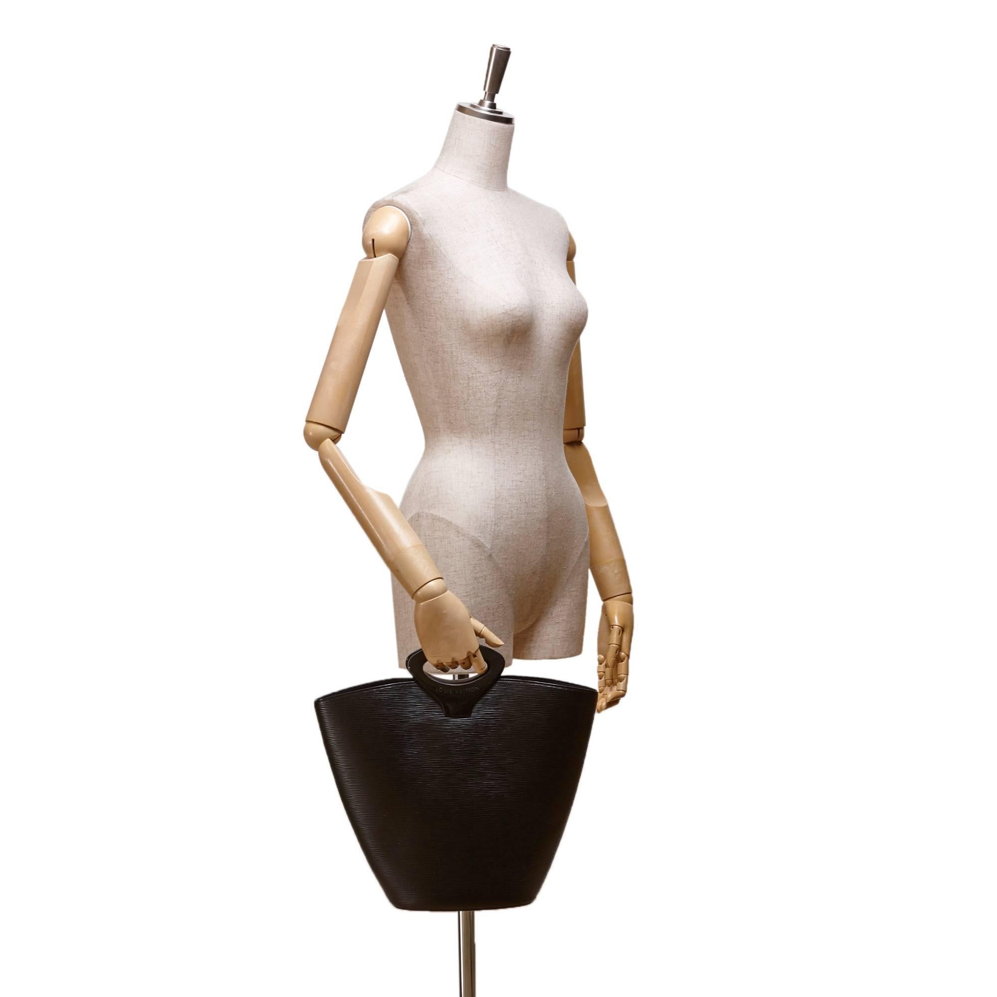 - This Louis Vuitton black Noctambule tote bag features an epi leather body, plastic handles, an open top, and an interior slip pocket. Love this original design with a chic handle of Louis Vuitton. 

- Made in France. 

- Size: 25cm x 29.5cm x