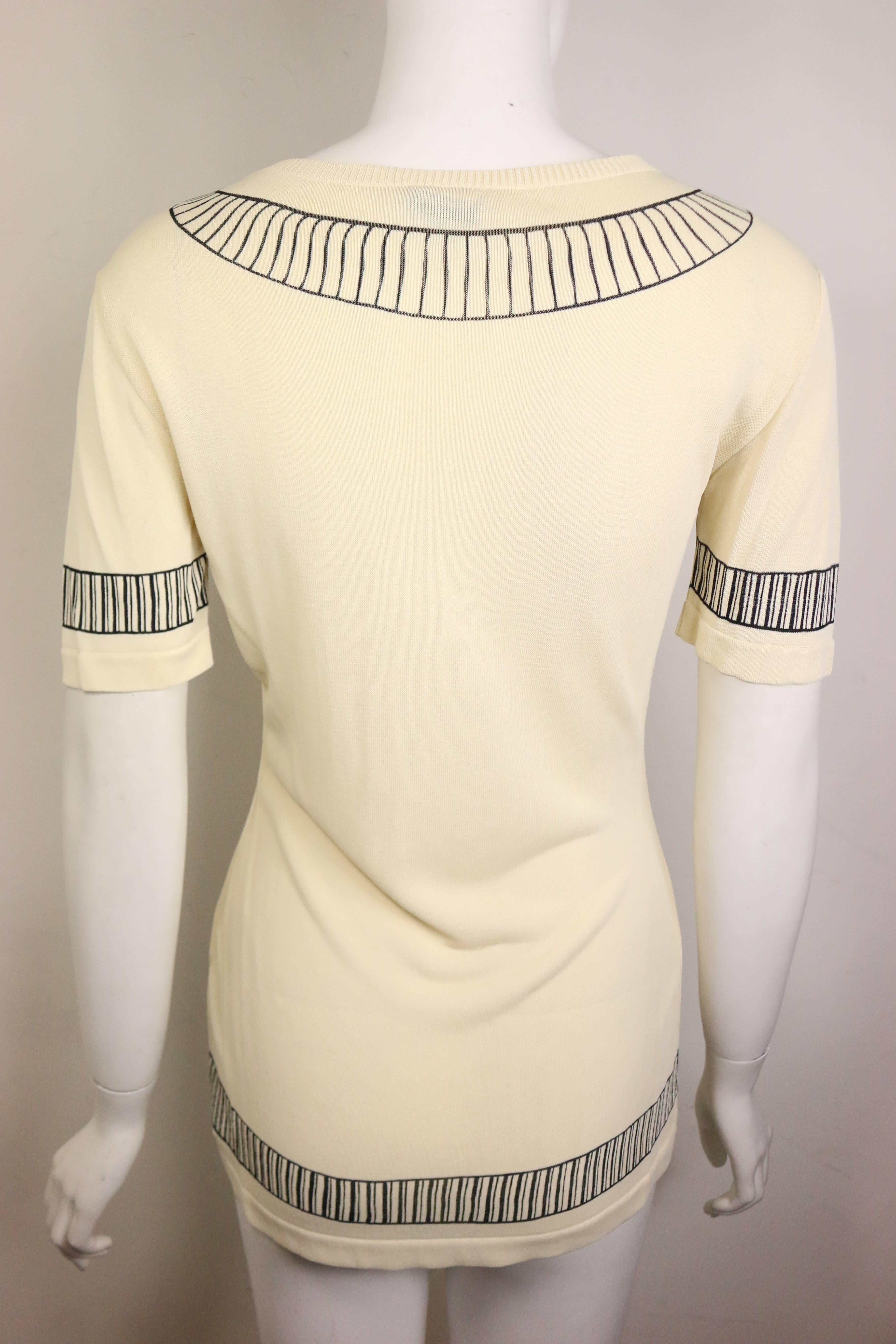 - Vintage 90s Moschino Couture lightweight short sleeves pullover beige top with polo collar shirt printed in black linings. Another fun and creative item from Moschino! 

- Made in Italy. 

- Size IT 40, FR 36 and US 6. 

- 100% Rayon. 

