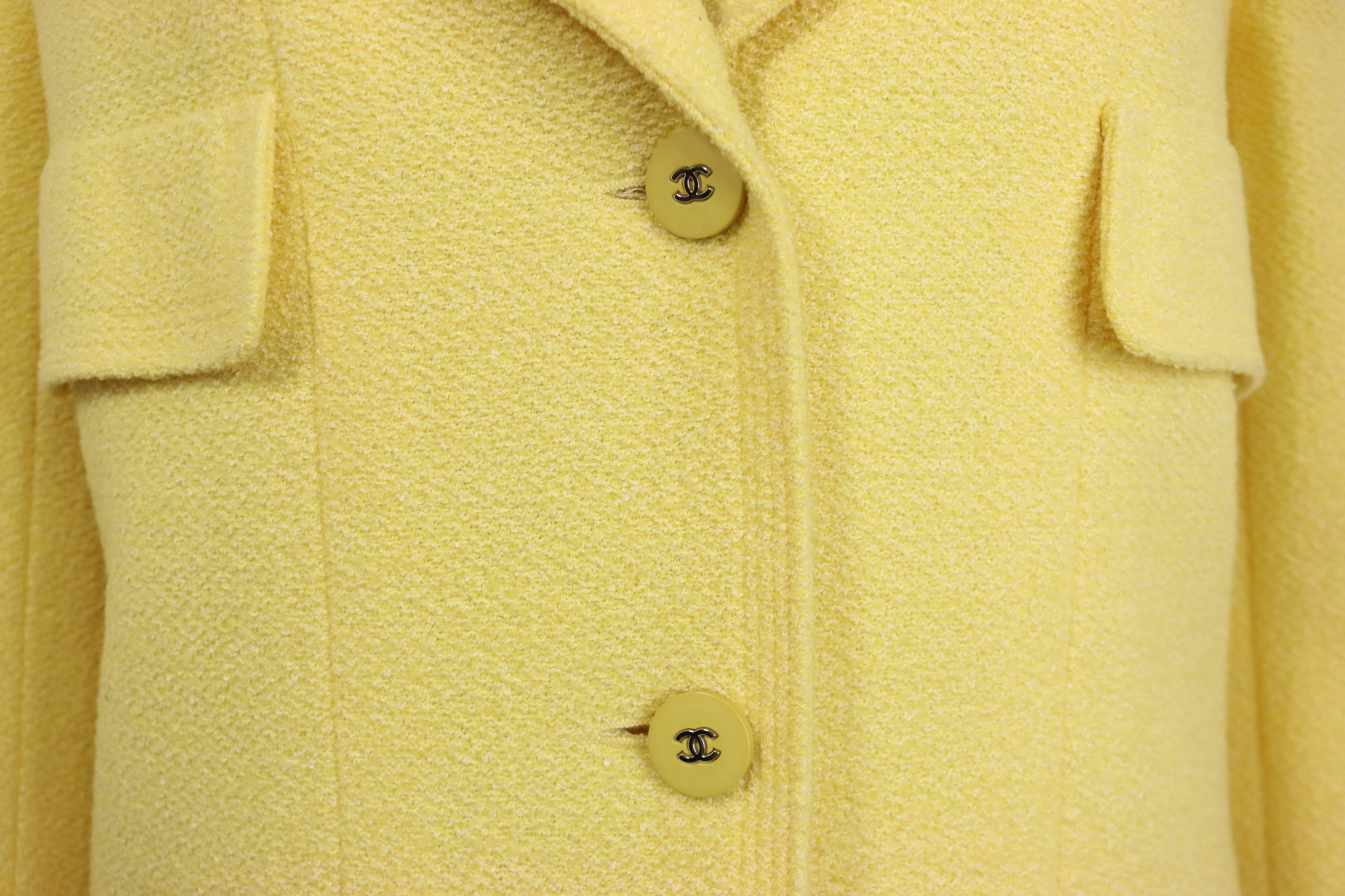 - Vintage Chanel yellow boucle wool jacket from 1998 spring/summer collection. This has never been worn before and still have original tag on it.  

- Featuring a four front flap pockets, two yellow 