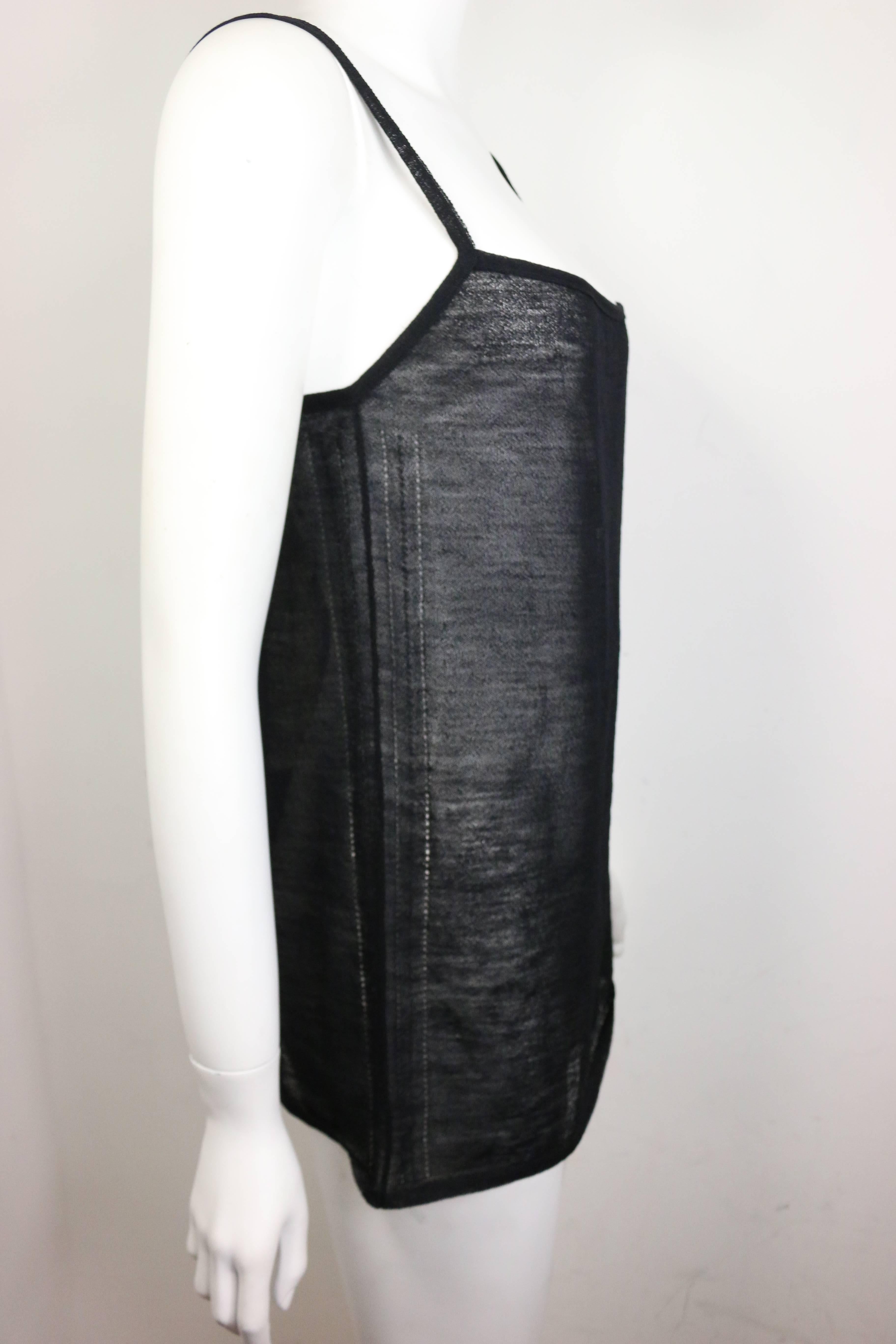 - Gucci by Tom Ford black wool see through spaghetti tank top from 1997 spring collection. One of the famous Tom Ford Gucci collection in history! 

- Made in Italy. 

- Size L. 

- 85% Wool, 15% Nylon. 

- Orignal tag still on.