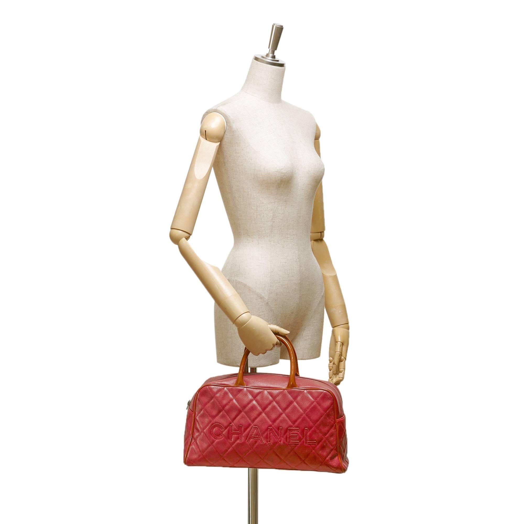 - This Chanel pink Matelasse logo bowling handbag features a leather body, exterior back zip pocket, orange patent leather rolled leather handles, top zip closure, and interior zip pocket. This great colour combination Chanel bowling bag is rare.