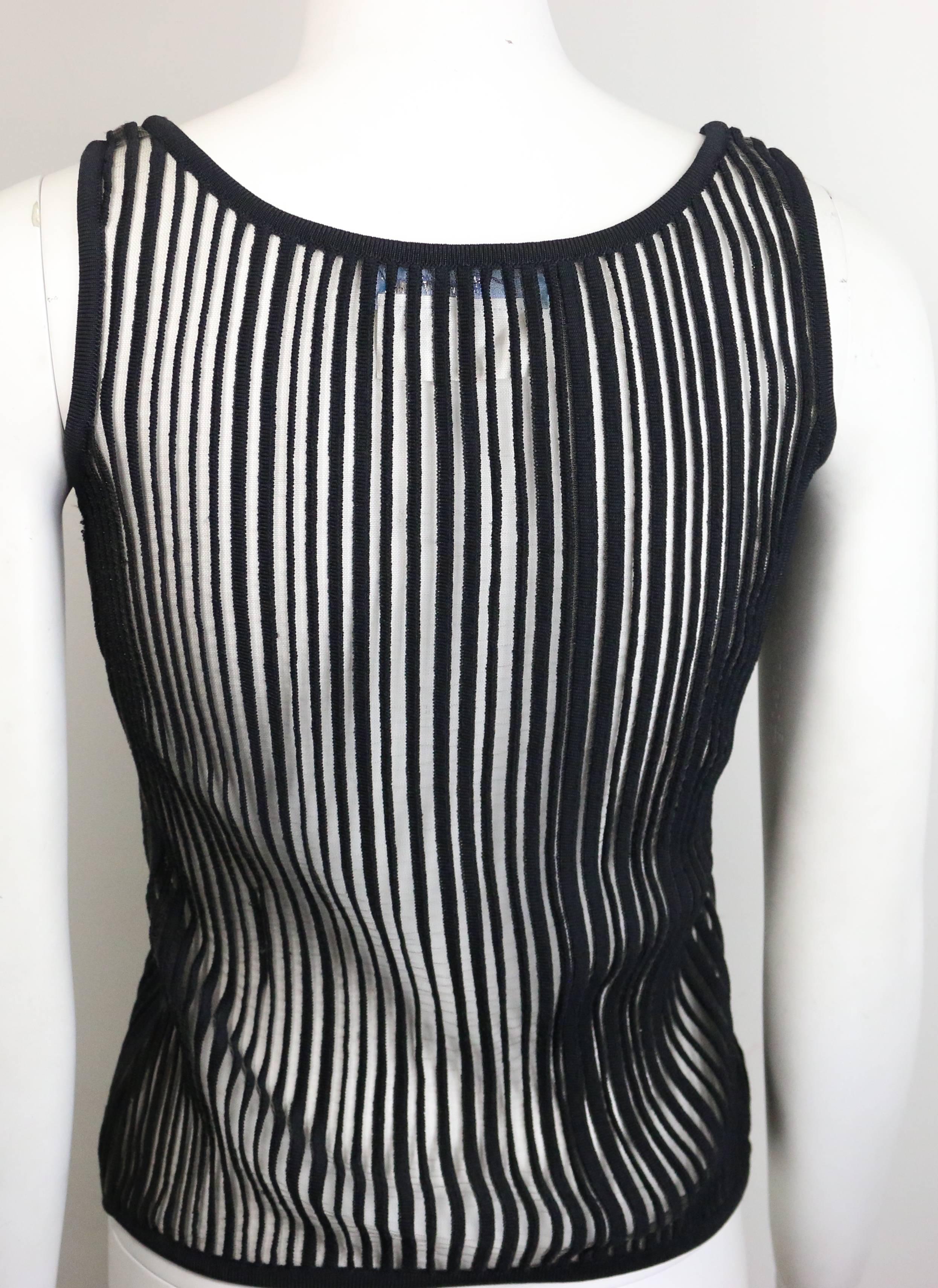 - Vintage 90s Thierry Mugler black knitted vertical stripe see through tank top. This sexy tank top is rare! 

- Made in Italy. 

- Size M. 

- 90% Nylon, 7% Polyamide, 3% Elasthanne. 



