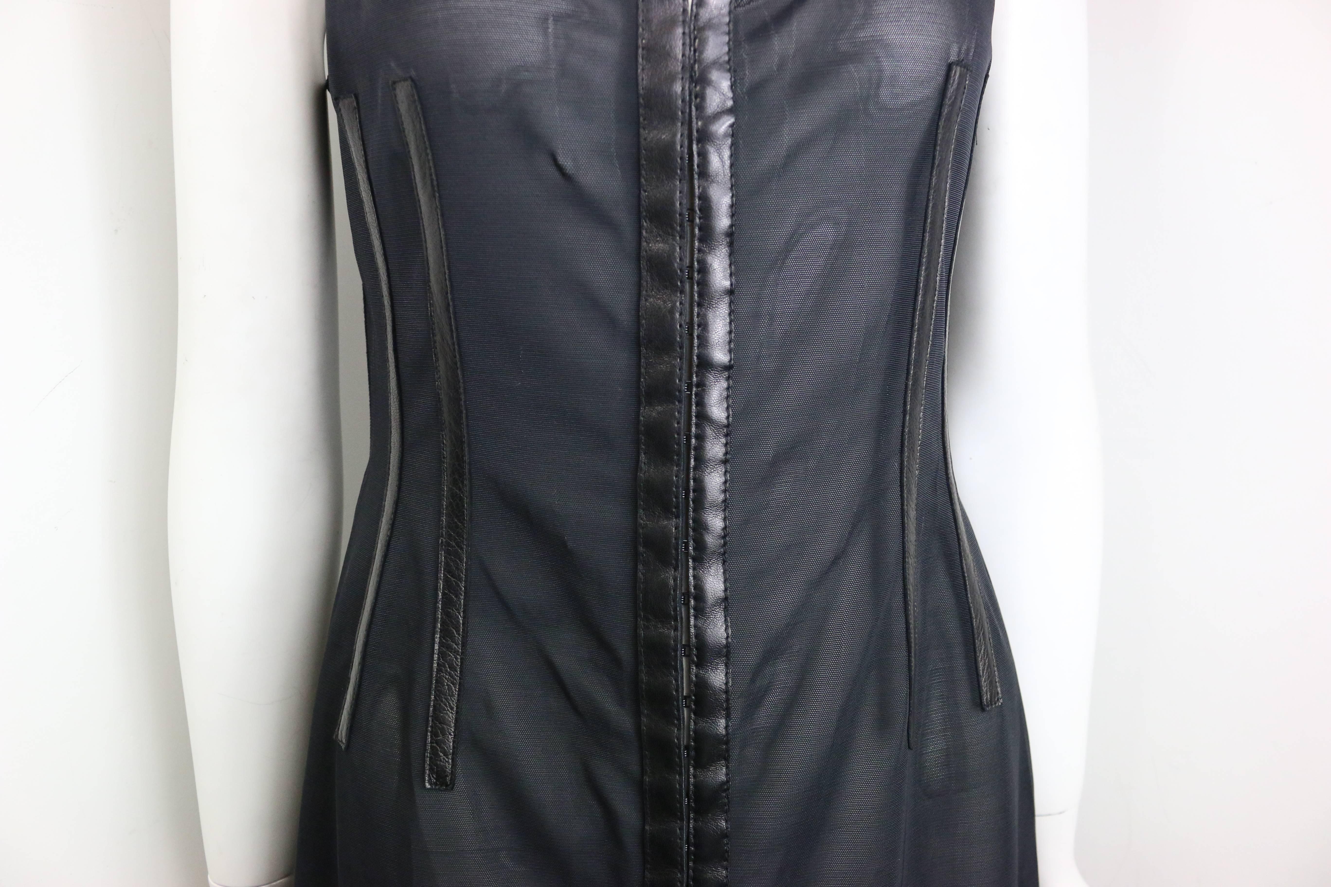 - Vintage 90s Plein Sud black leather trim see through sleeveless dress. Featuring thirty hooks for fastening closure. 

- Made in France. 

- Size 42. 

- 77% Nylon, 23% Spandex. 

- Original tag still attached to the dress. 