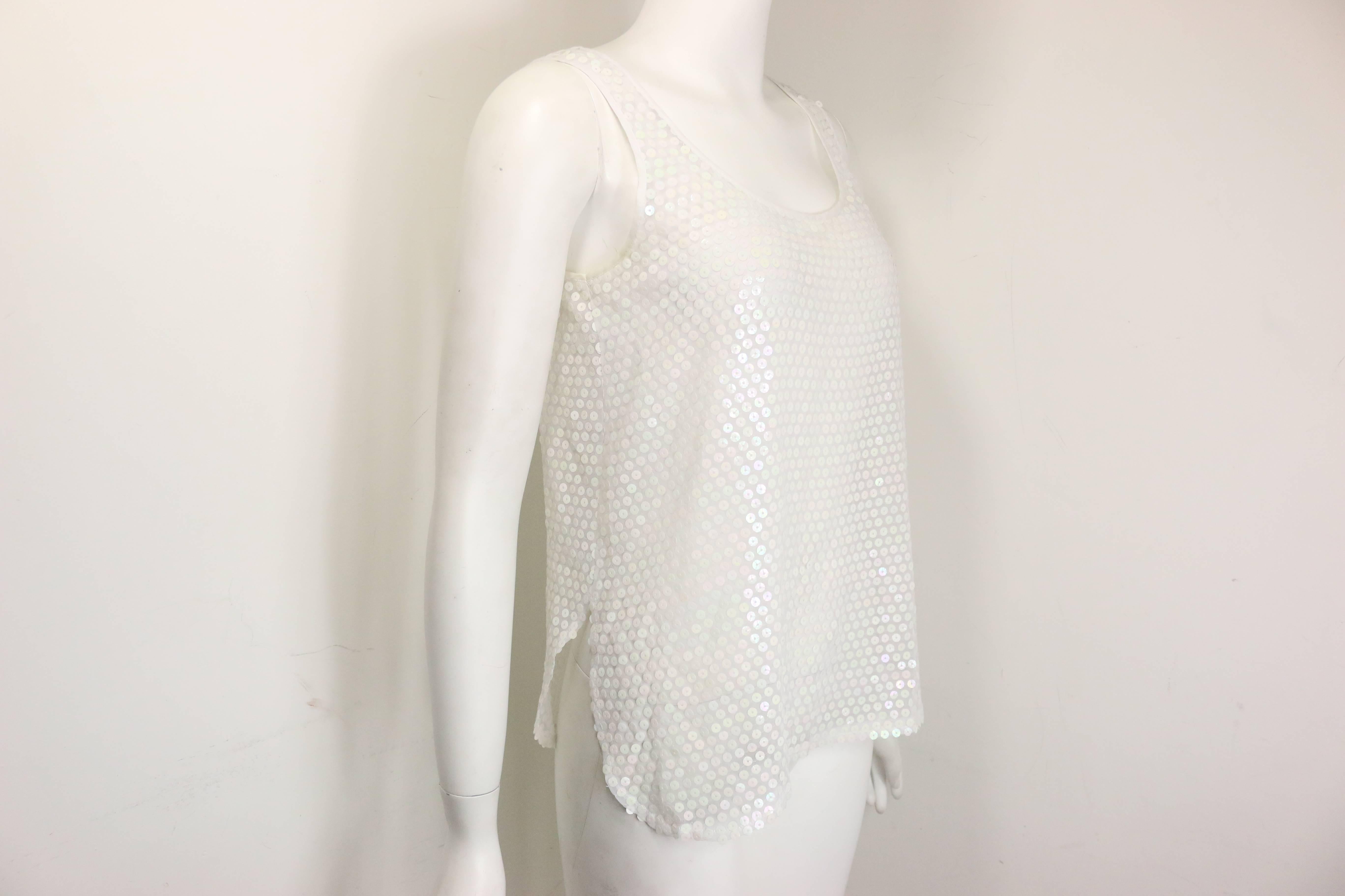 - Vintage 80s Crisca white sequins see through tank top. Sequin is shinny and radiant. What a great summer top!

- Made in Germany. 

- Size 36.

- 100% Polyester. 



 

