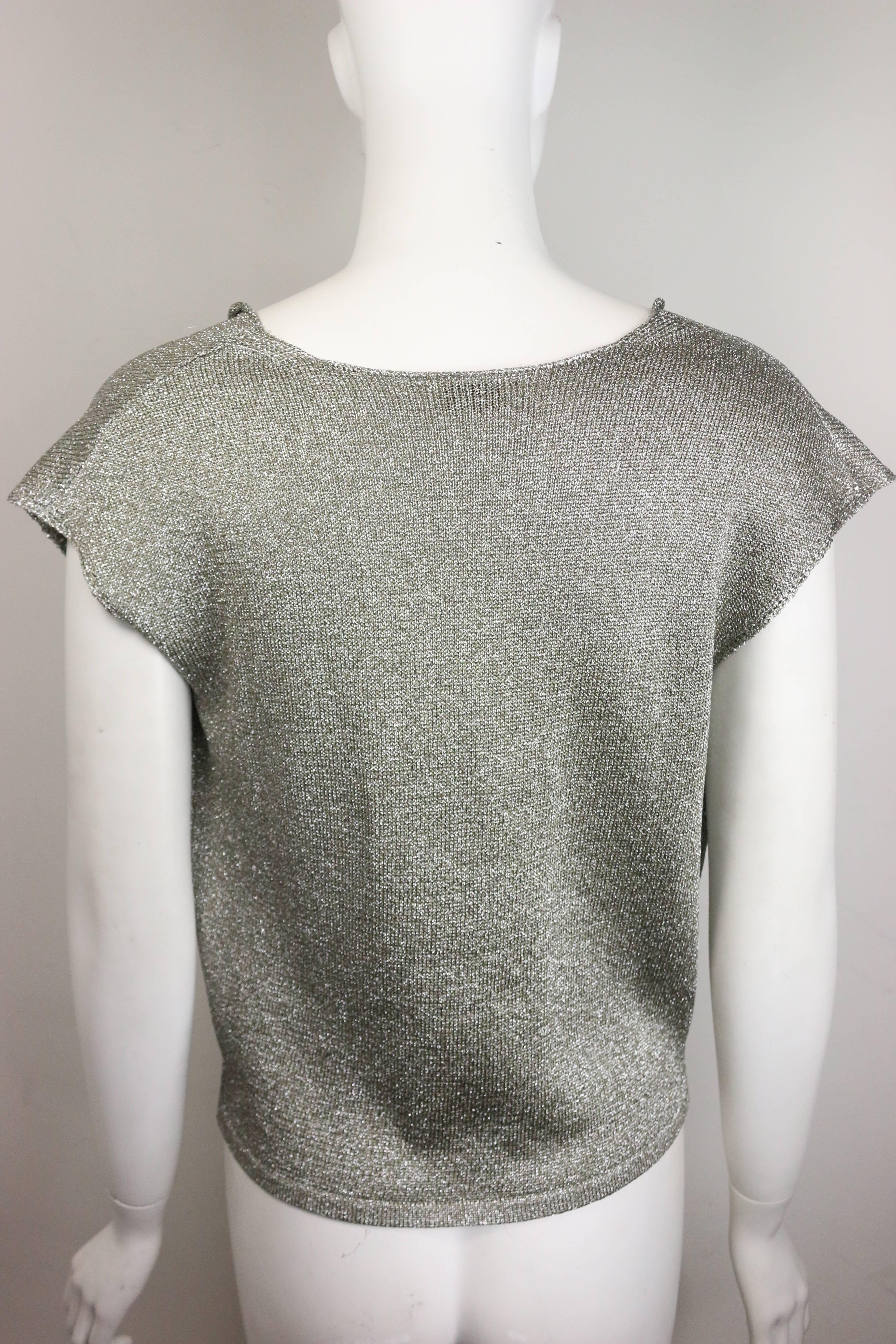 - Saint Laurent by Hedi Slimane silver metallic round neck top. This rock and roll and chic top is the signature of Hedi Slimane Saint Laurent era! 

- Made in Italy. 

- Size L. 

- 60% Rayon, 40% Polyester. 

