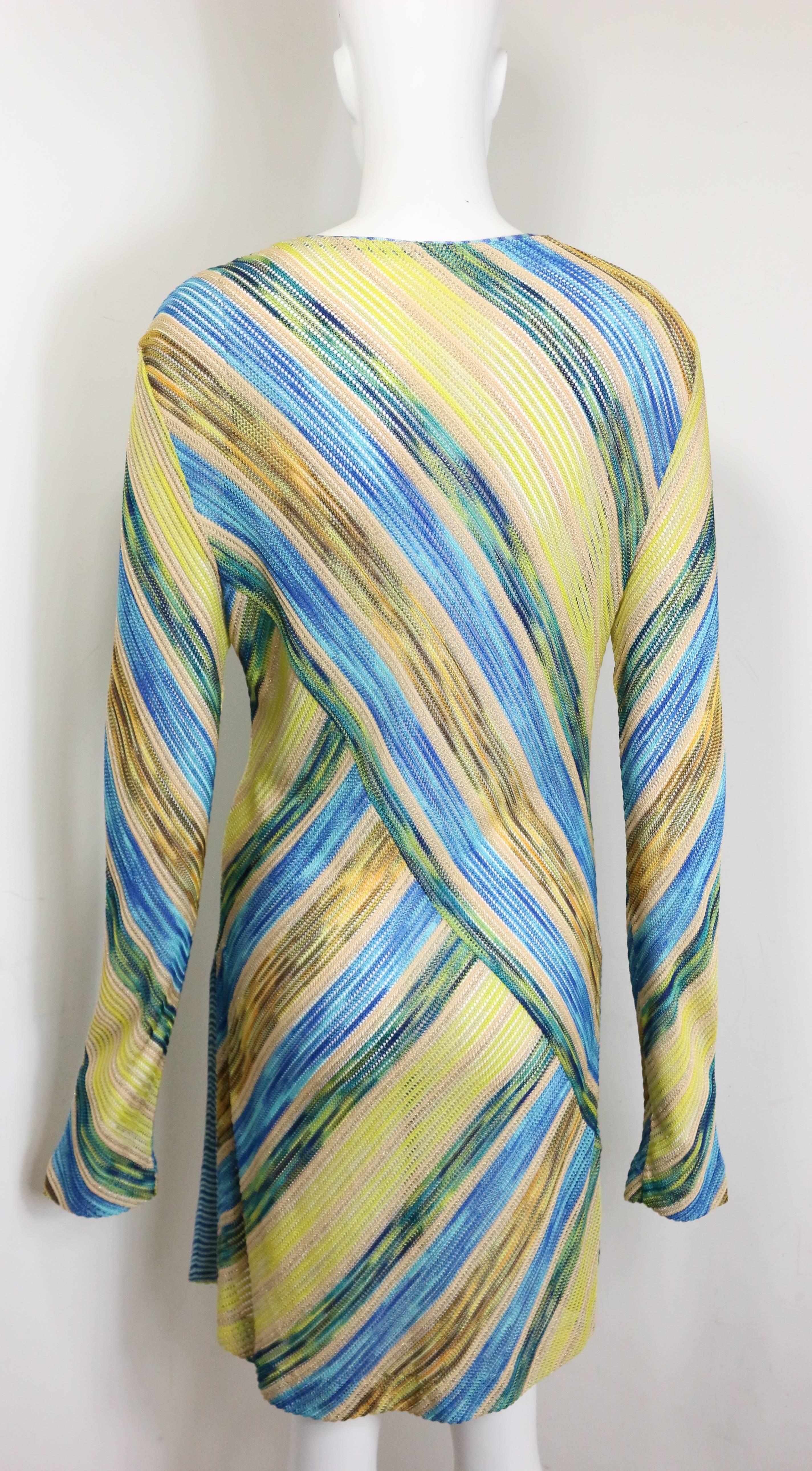 - Vintage 90s Missoni multi colour diagonal stripes knitted long sleeves dress. Featuring a round neckline and slit on both sides. A beautiful knitted dress with unique pattern. One of a kind! 

- Made in Italy. 

- 88% Viscose, 8% Rayon, 4%