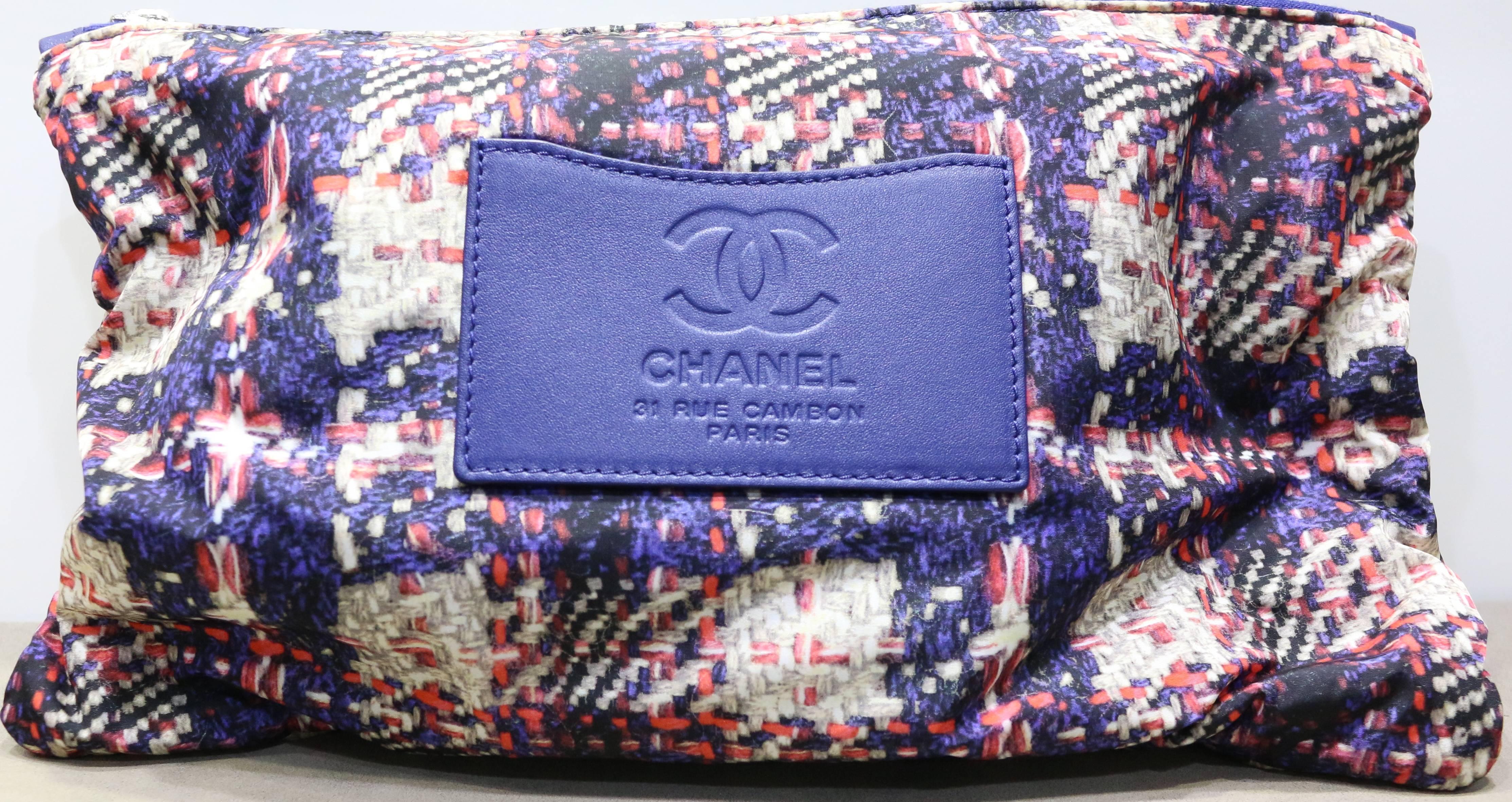 - Chanel red/white/blue check pattern nylon shoulder bag. Featuring a blue leather silver hardware chain strap, a silver hardware "CC" interlock closure. The bag comes with a same pattern pouch bag. A blue nylon interior with zipper. This
