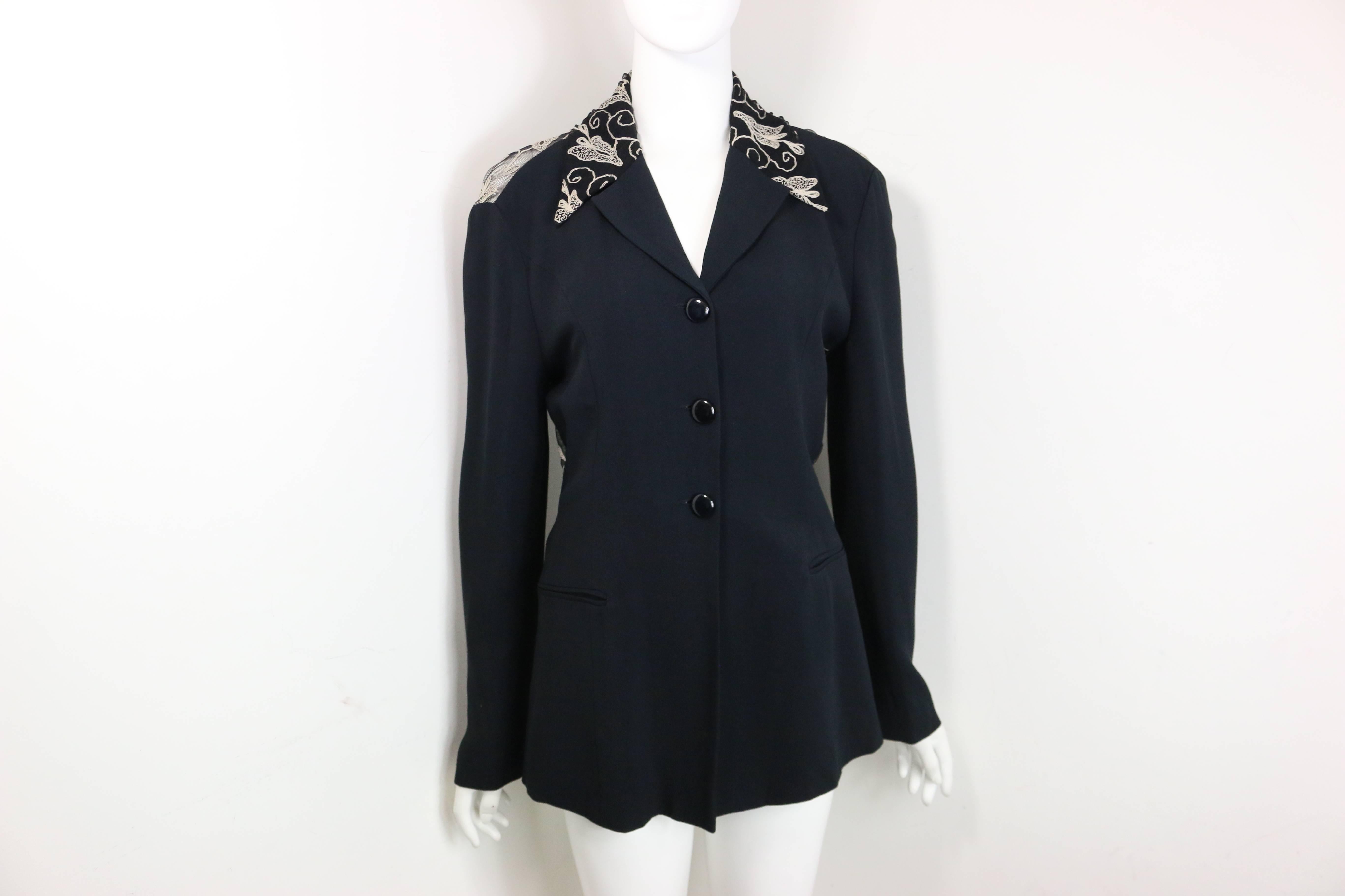 - Vintage 90s Batik Black Jersey Jacket with white embroidered leaves pattern lace behind. Featuring three black buttons closure with two front slip pockets. Such a beautiful jacket with embroidered details behind! 

- Made in Italy. 

- Size IT42,