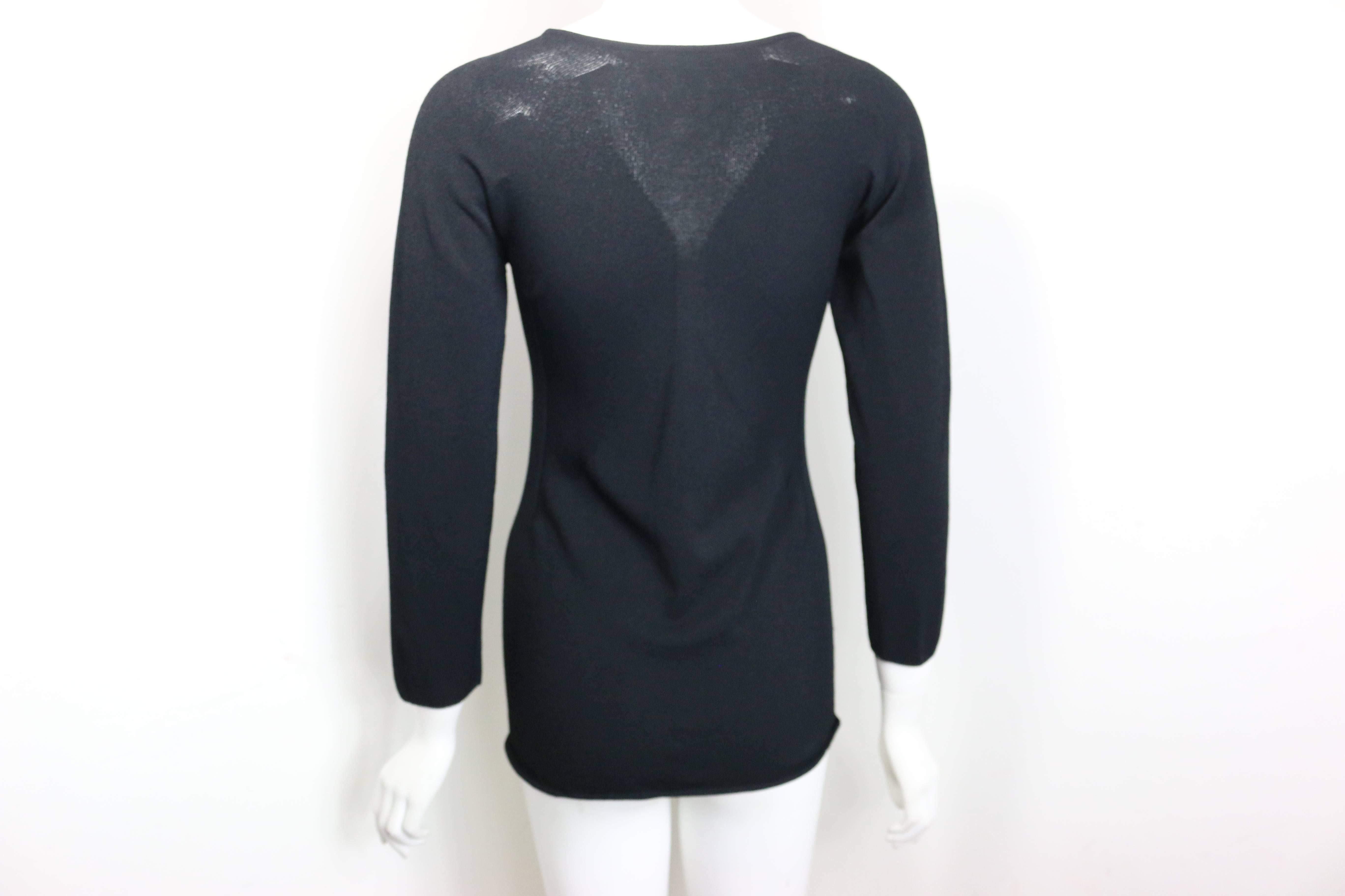 - Chanel black 3/4 sleeves top from 2002 cruise collection. 

- Made in France. 

- Size 44. 

- 75% Rayon, 25% Polyester. 