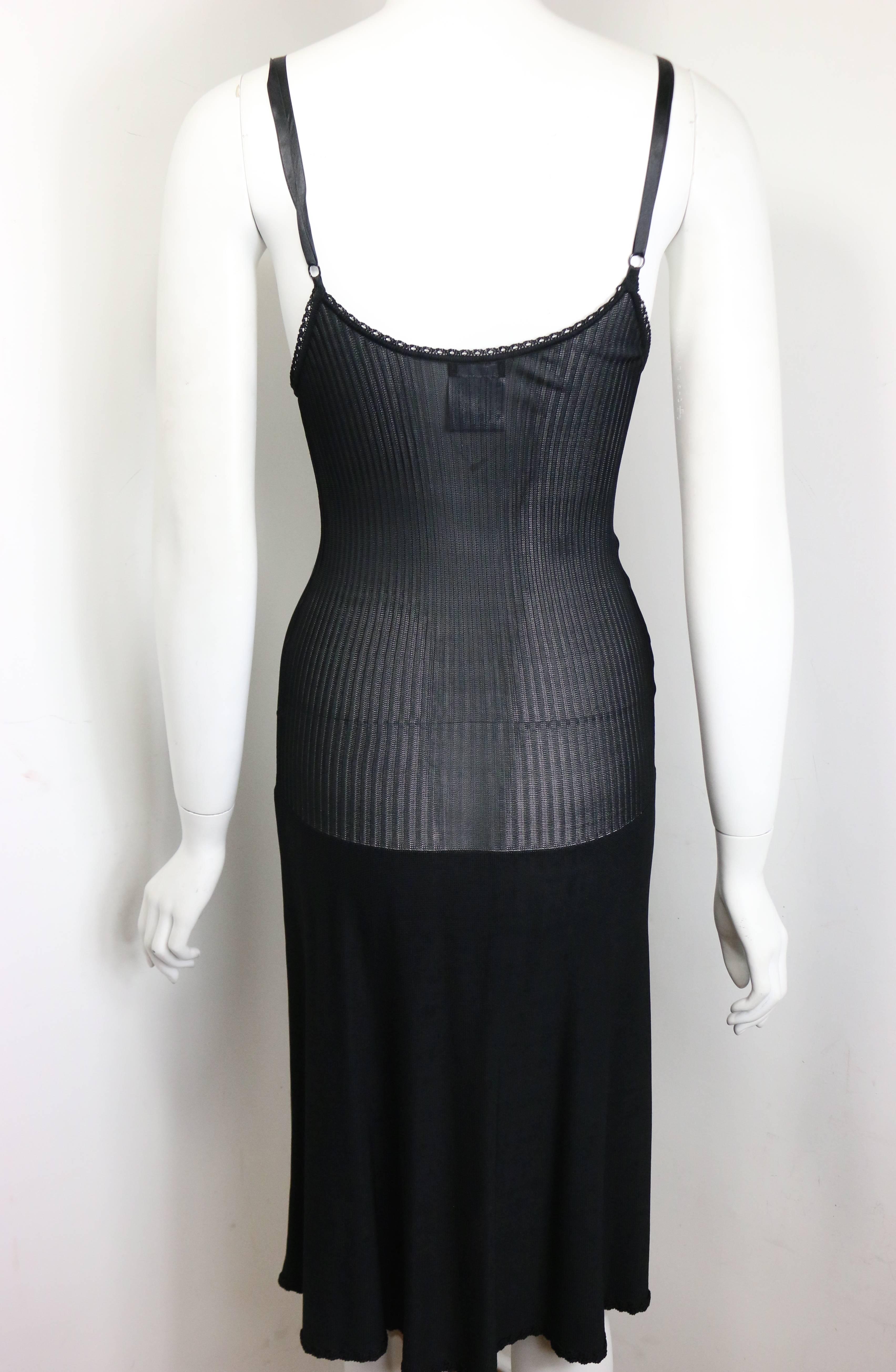 - Year 2008p Chanel black spaghetti strap knitted dress featuring a black lace bust area, light knitted in the middle, and knitted bottom. A black rhinestones 