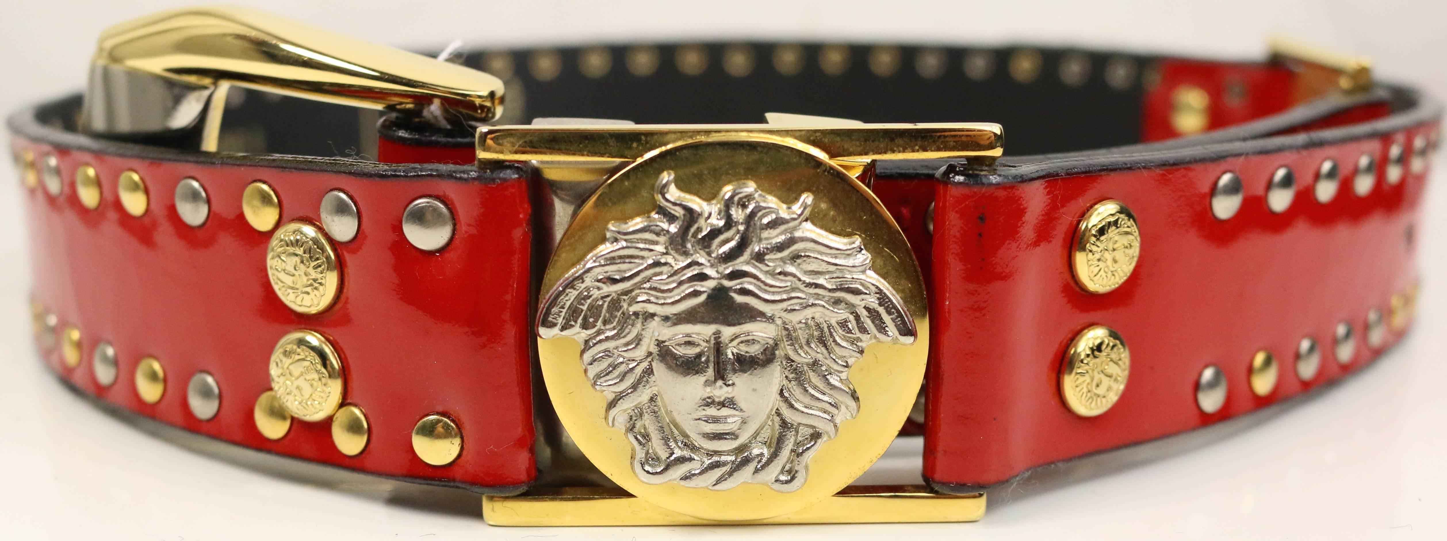 - Vintage 90s Gianni Versace red patent leather belt. Featuring  two 