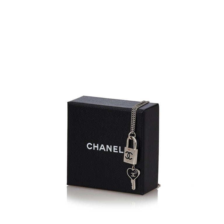 Chanel Silver Toned CC Padlock and Heart Key Necklace at 1stDibs  chanel  lock and key necklace, chanel pendant necklace silver, key chain