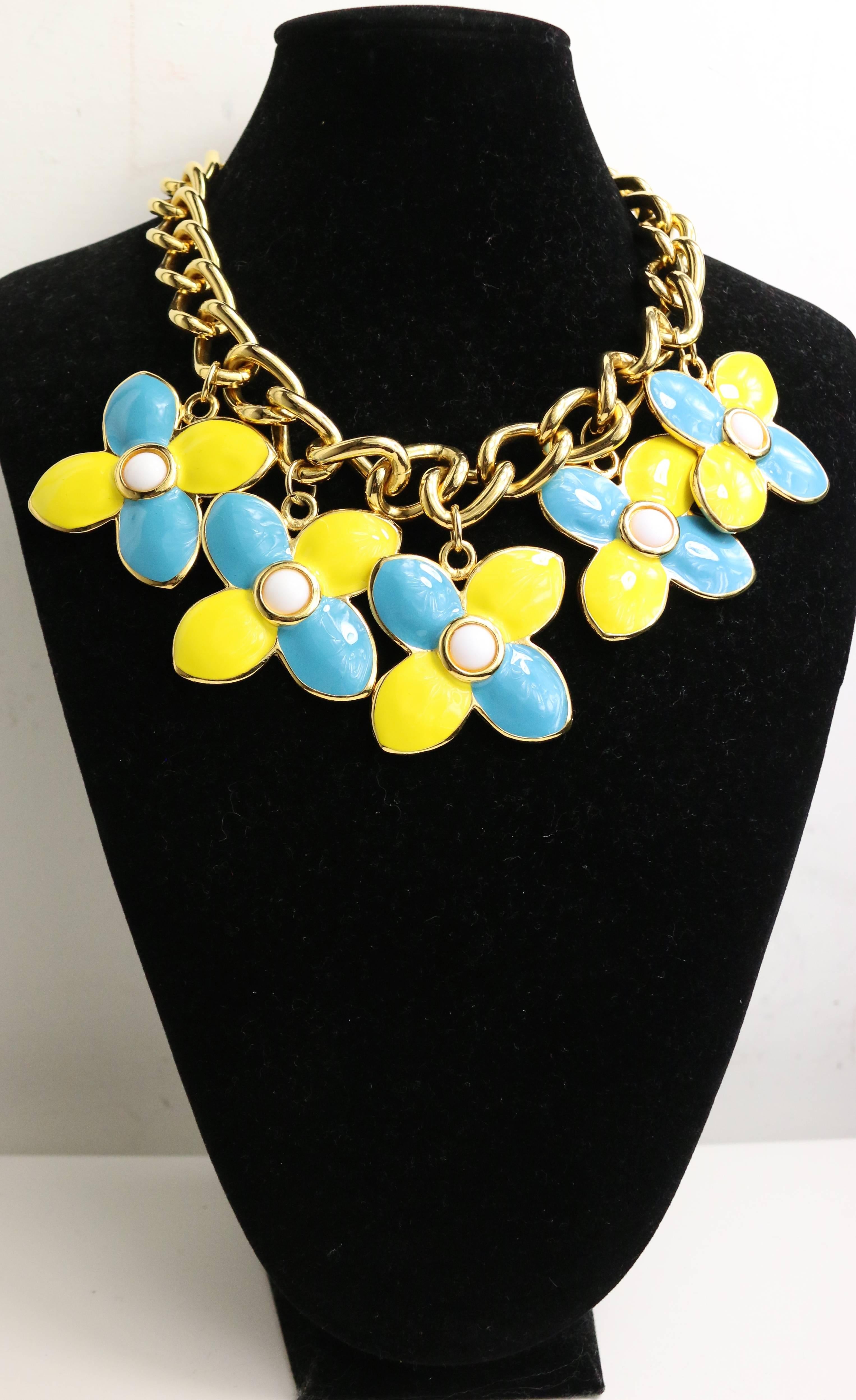- Vintage 80s Escada yellow and light blue clovers gemstones with a white round gemstone in the center. Featuring a gold toned chain with a hook closure. Such a bright color and cute necklace. Wear it with joy!

- Made in Germany. 

- Total length: