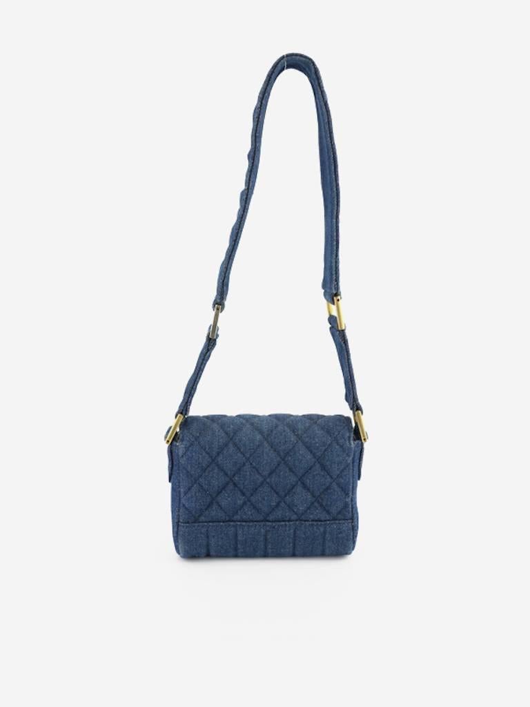 - Vintage 80s Chanel blue denim quilted mini flap shoulder bag. Featuring a gold toned "CC" turn lock closure, a denim with four gold toned hardware strap, an interior leather slip pocket. The vertical stripe on the bottom makes a contrast