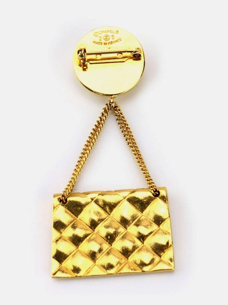 - Vintage Chanel collection gold plated quilted flap bag drop dangle pendant pin brooch from season 25. 

- Made in France. 

- Size: W 1.34 × H 3.07 inches. 

- Include: Box. 

