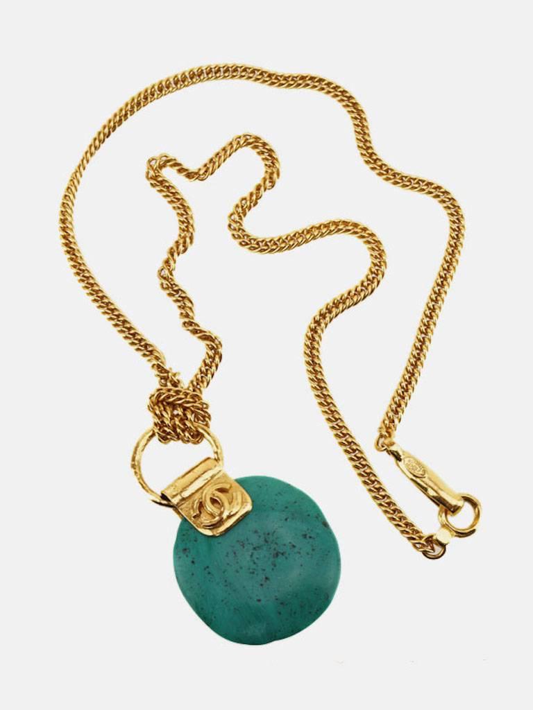 - Vintage 1998P Chanel turquoise stone pendant with gold toned plated chain necklace. 

- Made in France. 

- Chain Size: 35 cm (13.78 inches). 

- Pendant Size: W 4.7 × H 5.6 cm (W 1.85 × H 2.36 inches). 

- Include: Box. 

