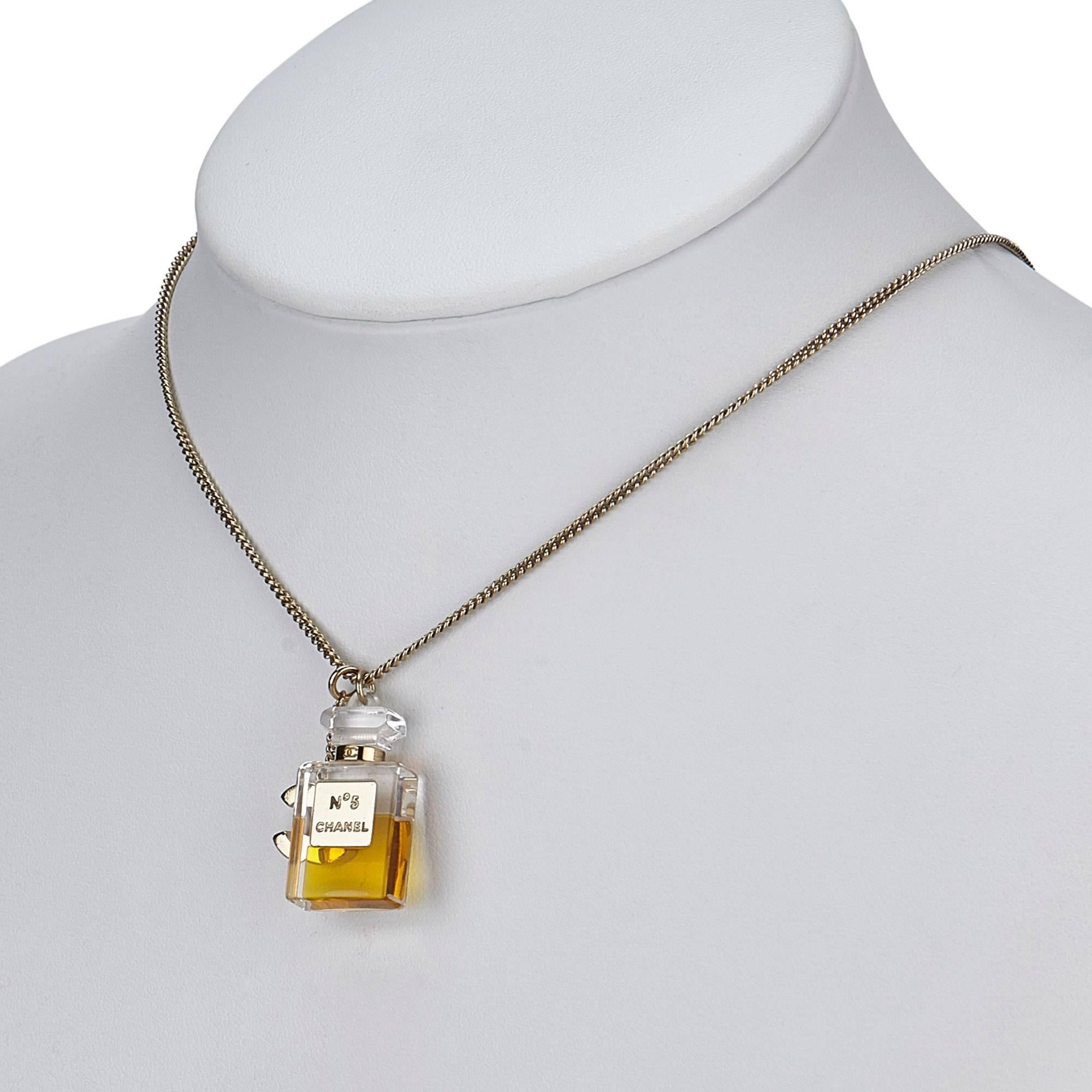 - This 2004A Chanel Pendants necklace features the iconic resin No.5 fragrance bottle charm, gold toned hardware "CC" logo charm, gold-tone chain, and springring closure. A classic Chanel No.5 perfume bottle charm with "CC" logo