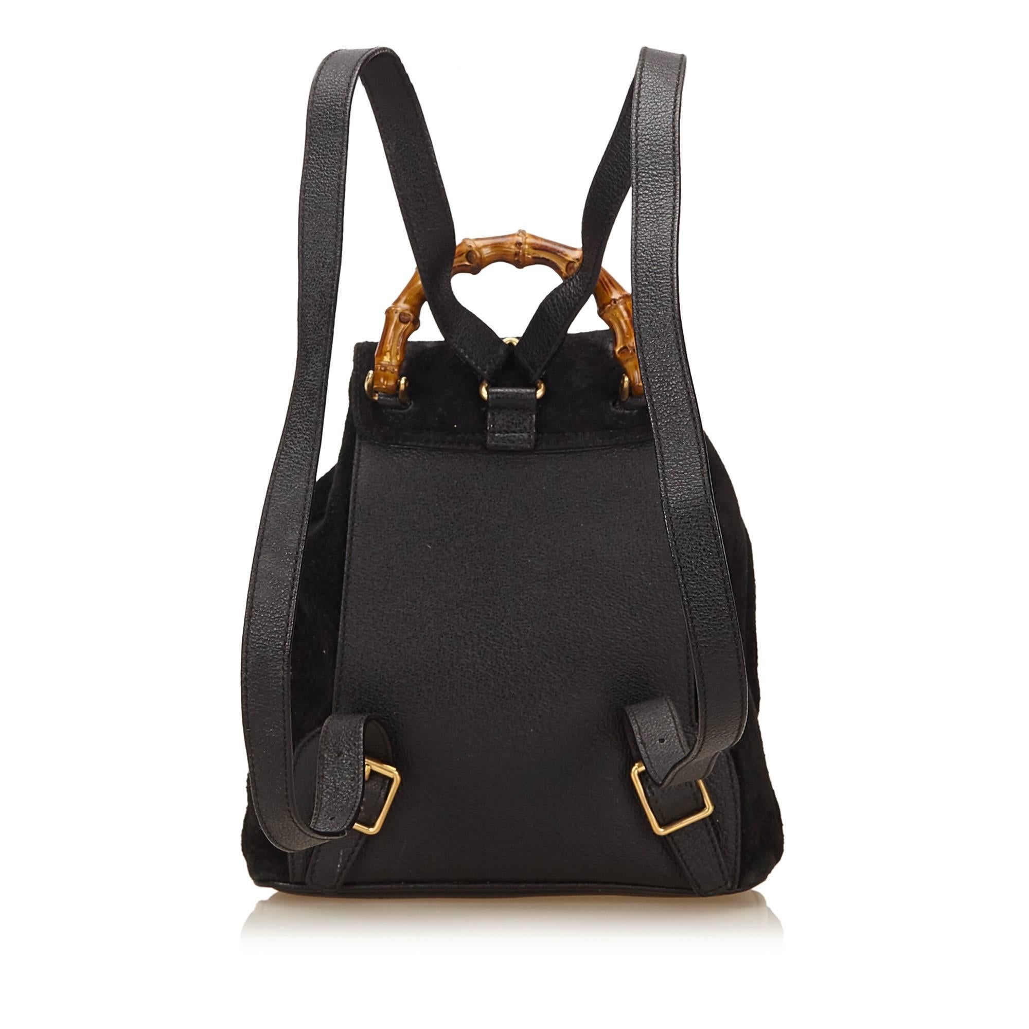 - This Gucci backpack features a suede body with leather trim, front exterior flap pocket with twist bamboo closure, adjustable leather shoulder straps, drawstring closure, and interior zip pocket. A classic Gucci backpack that it still in style