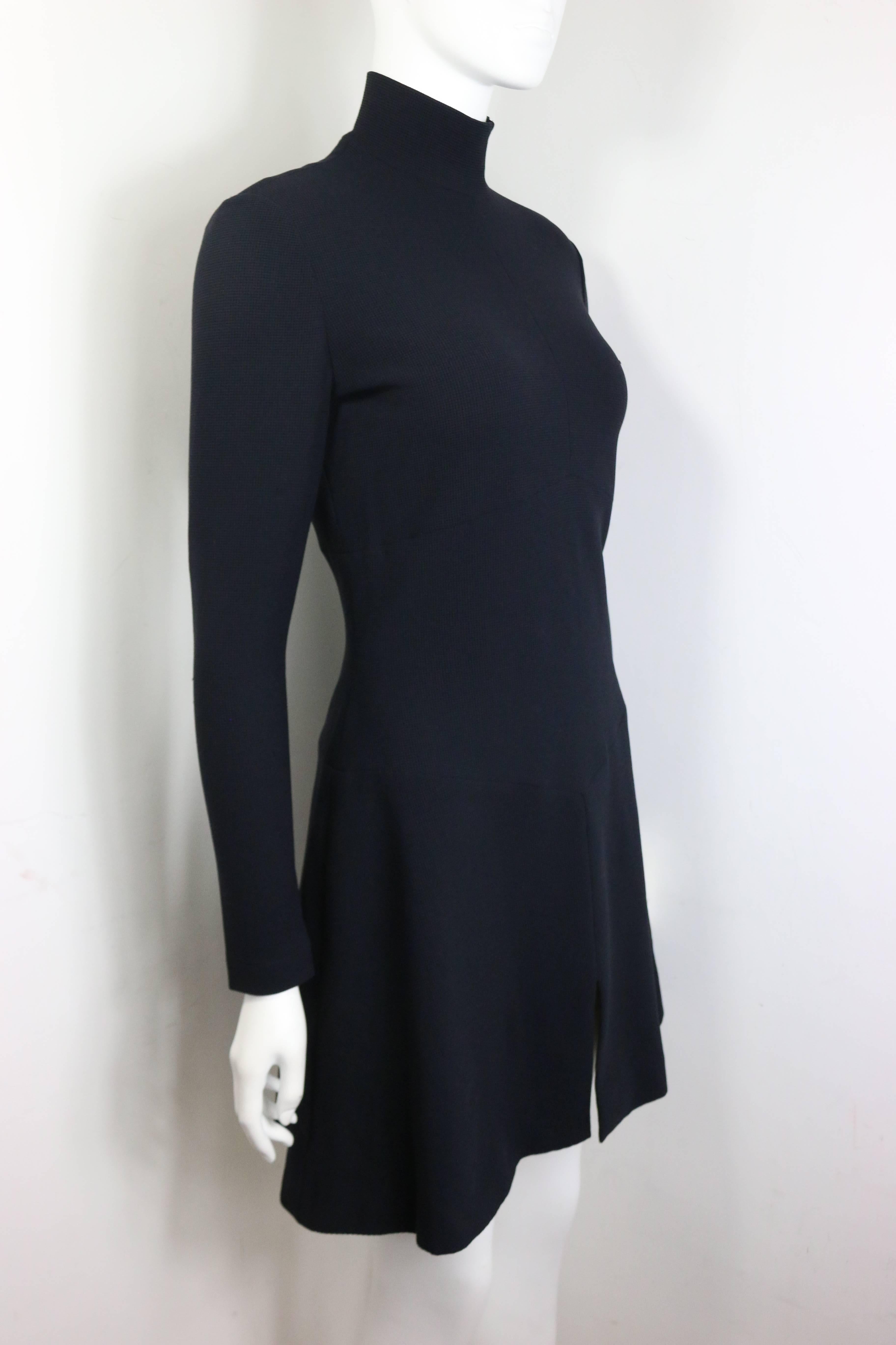 - Vintage Chanel black high neck long sleeves dress from 1995 pre collection. Featuring slit on the bottom in the front, a neck side zipper and body side zipper closure. A classic Chanel long sleeves stretchy A-Shape dress is a great choice for a
