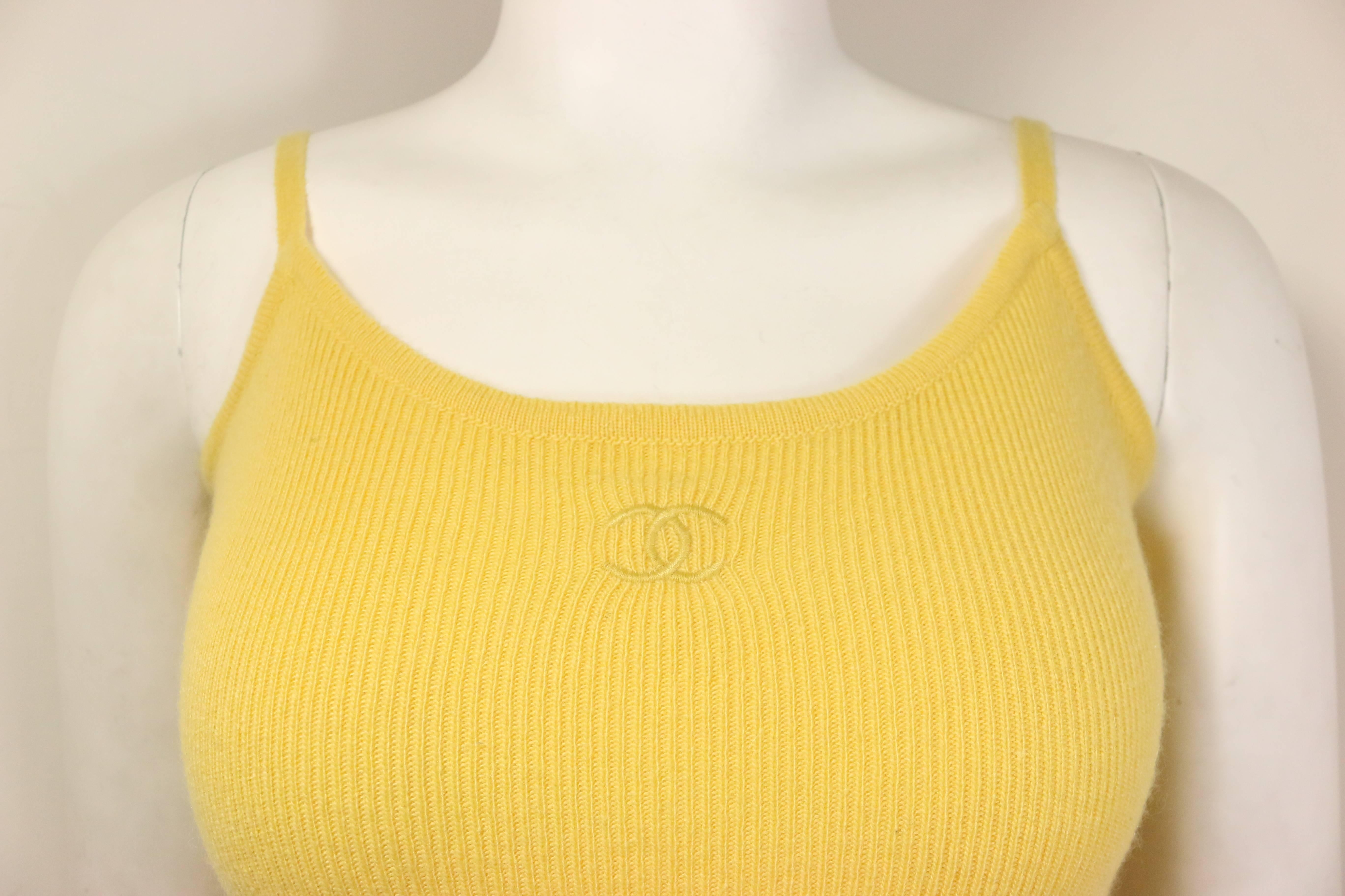 - Vintage Chanel yellow cashmere bodysuit from 1994 A/W collection. Featuring a "CC" logo. 

- Made in France. 

- Size 40. 

- 100% Cashmere. 