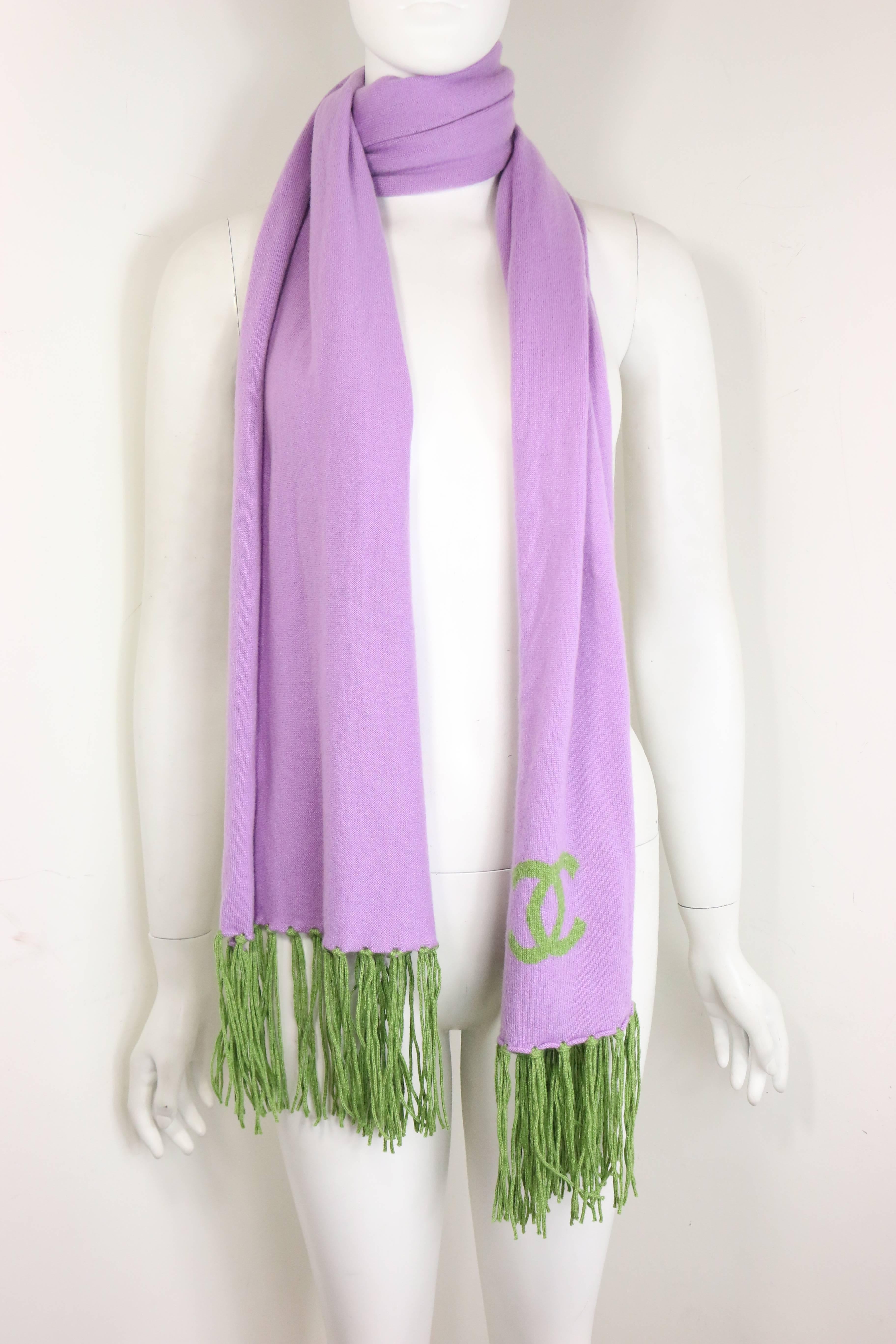 - Chanel purple cashmere scarf with green fringe from 2007 A/W collection. Featuring a green "CC" logo on the scarf. Excellent quality and colourful scarf for winter. 

- Made in France. 

- One Size. 

- Length: 70 inches. Width: 15