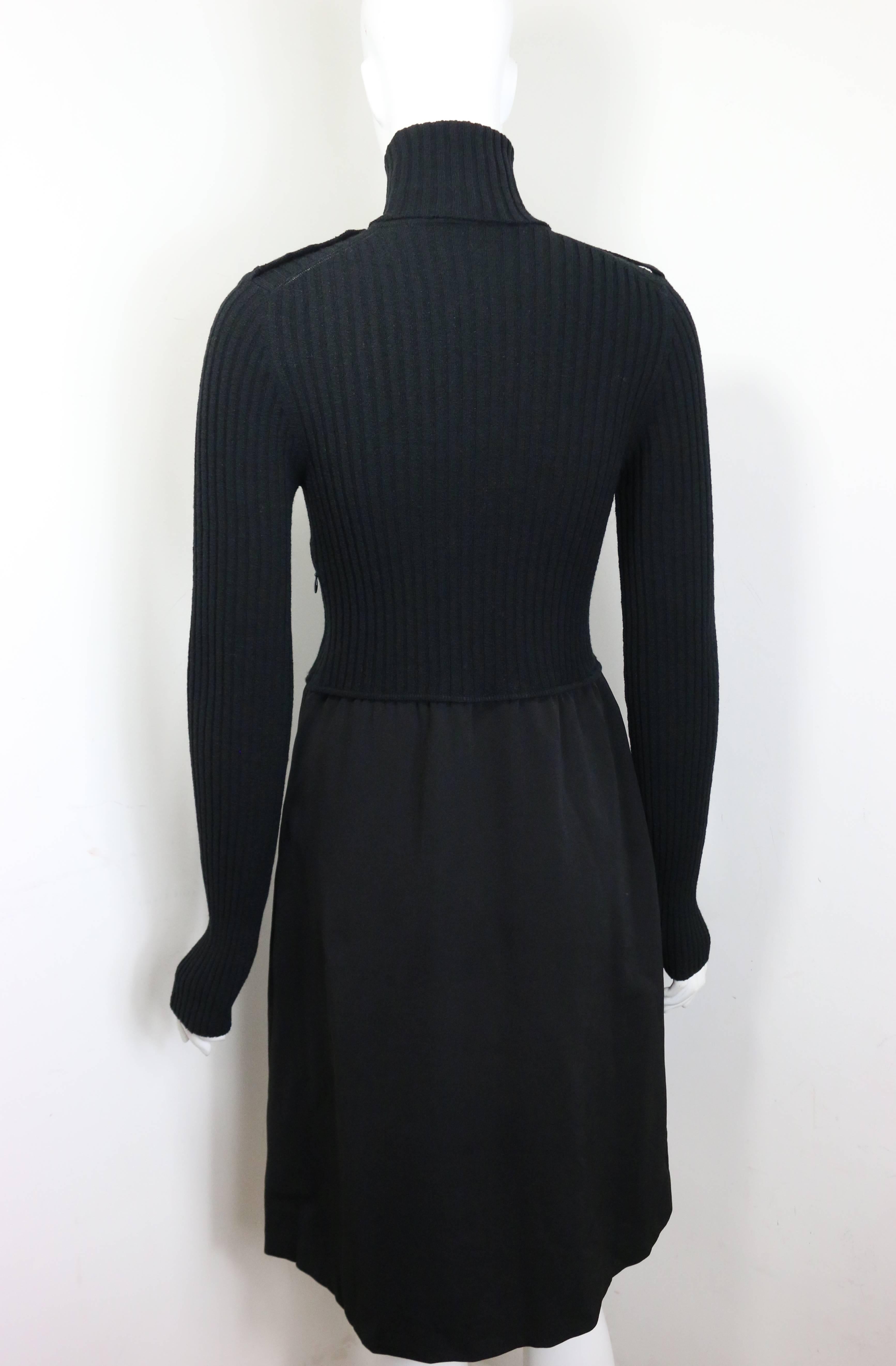- Unworn Gucci by Tom Ford black bi fabrics long sleeves turtleneck dress from Fall 1996 collection. 

- Epaulette Shoulders. 

- Side zip closure. 

- Zipper pocket on the waistline. 

- Size 44. 

- 37% Nylon, 25% Wool, 24% Acrilica, 10% Rayon, 4%