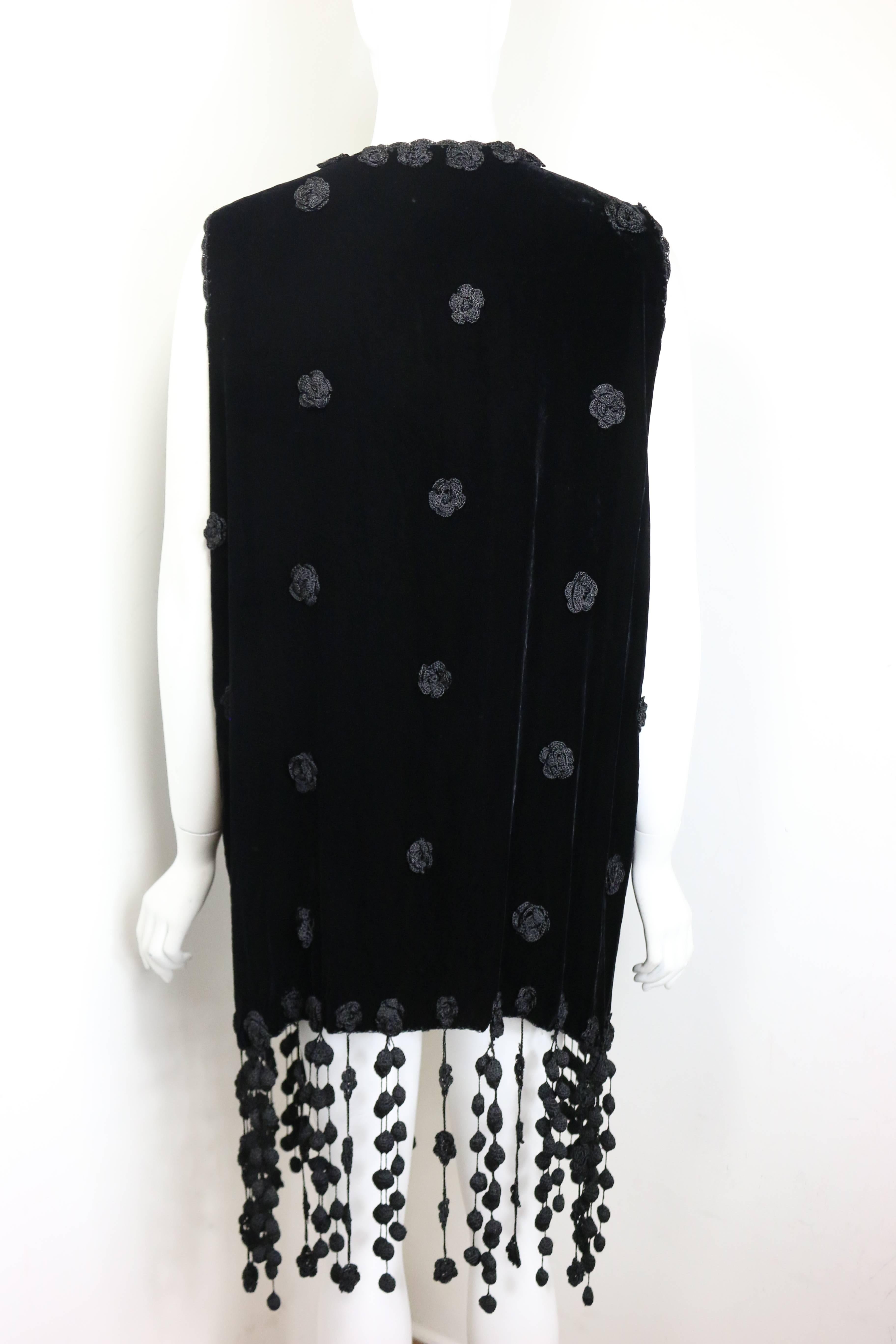 - Vintage 80s Cheap and Chic by Moschino black velvet and knitted flower embroidered long vest. Featuring a silk knitted lining and knitted fringes. A very creative and an interesting Moschino vest!

- Made in Italy. 

- Size 40 Italy. 

- Shoulder: