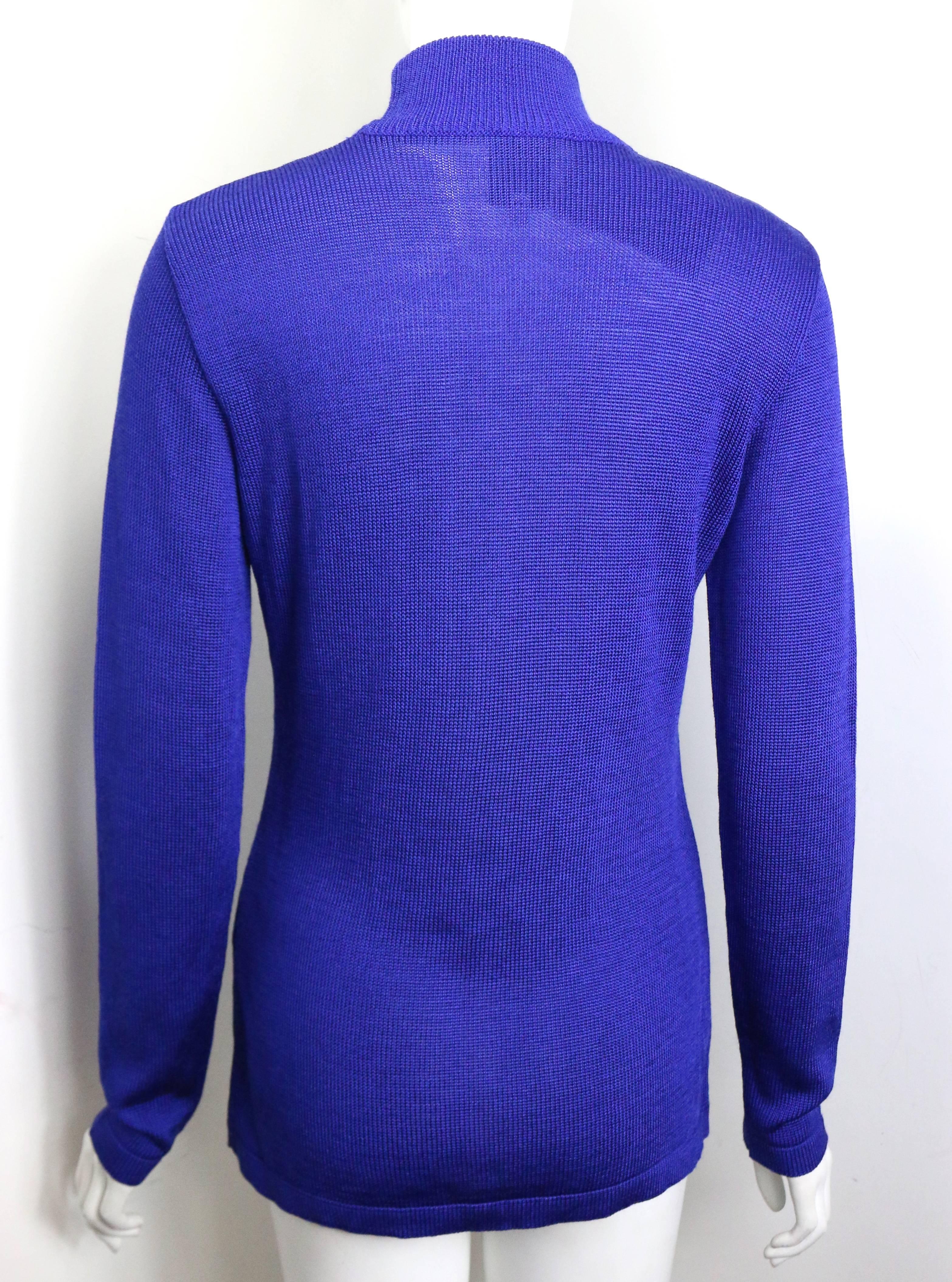 - Vintage 80s Claude Montana blue wool high neck pullover sweater with vertical patent leather trim in front. 

- Size 40. 

- Height: 26.25 inches. Sleeve: 25 inches. Bust: 28 inches. 

- - 60% Rayon, 40% Wool. 
