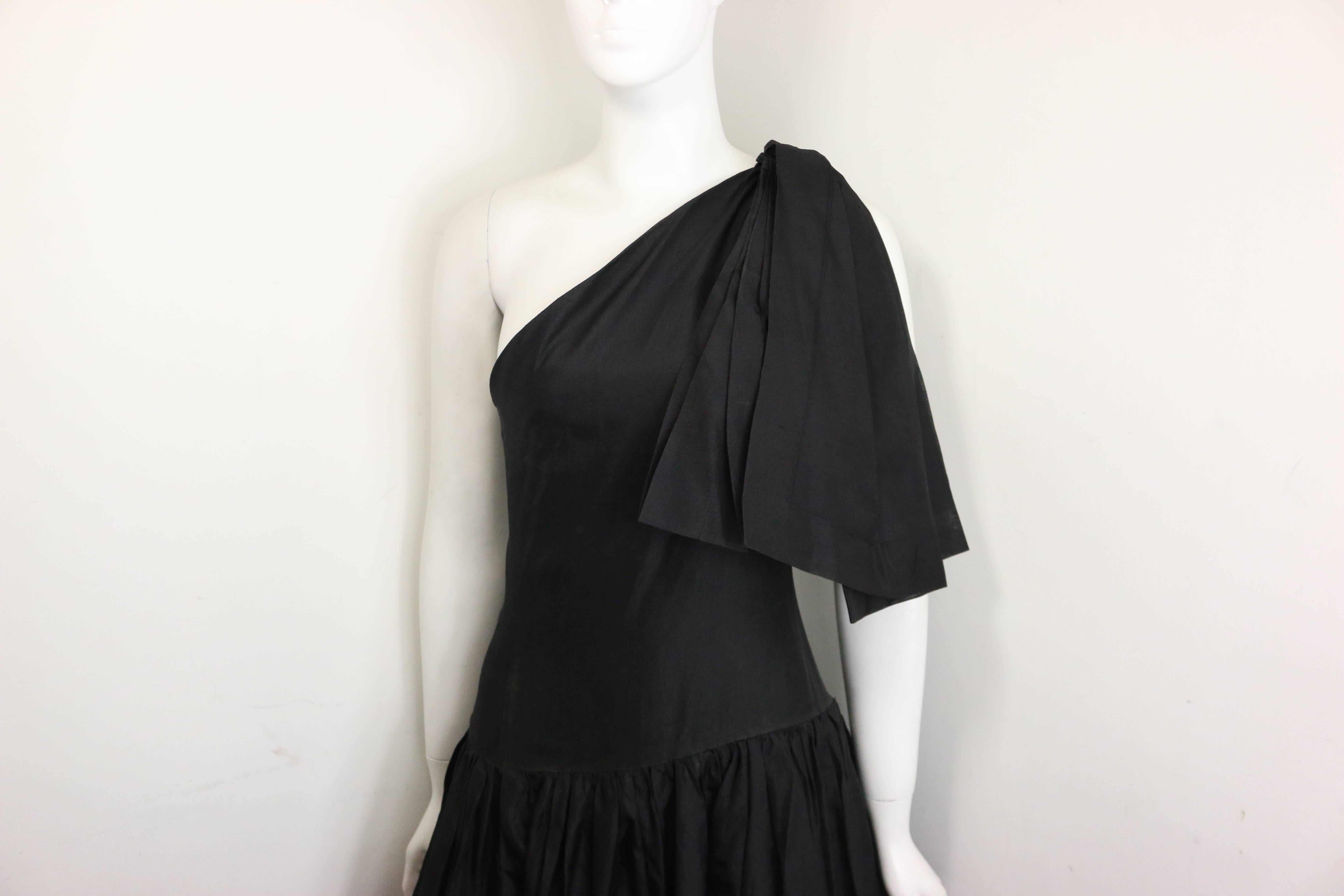 - Vintage Chanel black silk taffeta one shoulder evening gown from 1986 collection. Museum quilty!!!

- Pleated shoulder and bottom part of the dress. 

- Two layers. 

- Side zipper closure. 

- Three hooks closure on the shoulder. 

- Since this