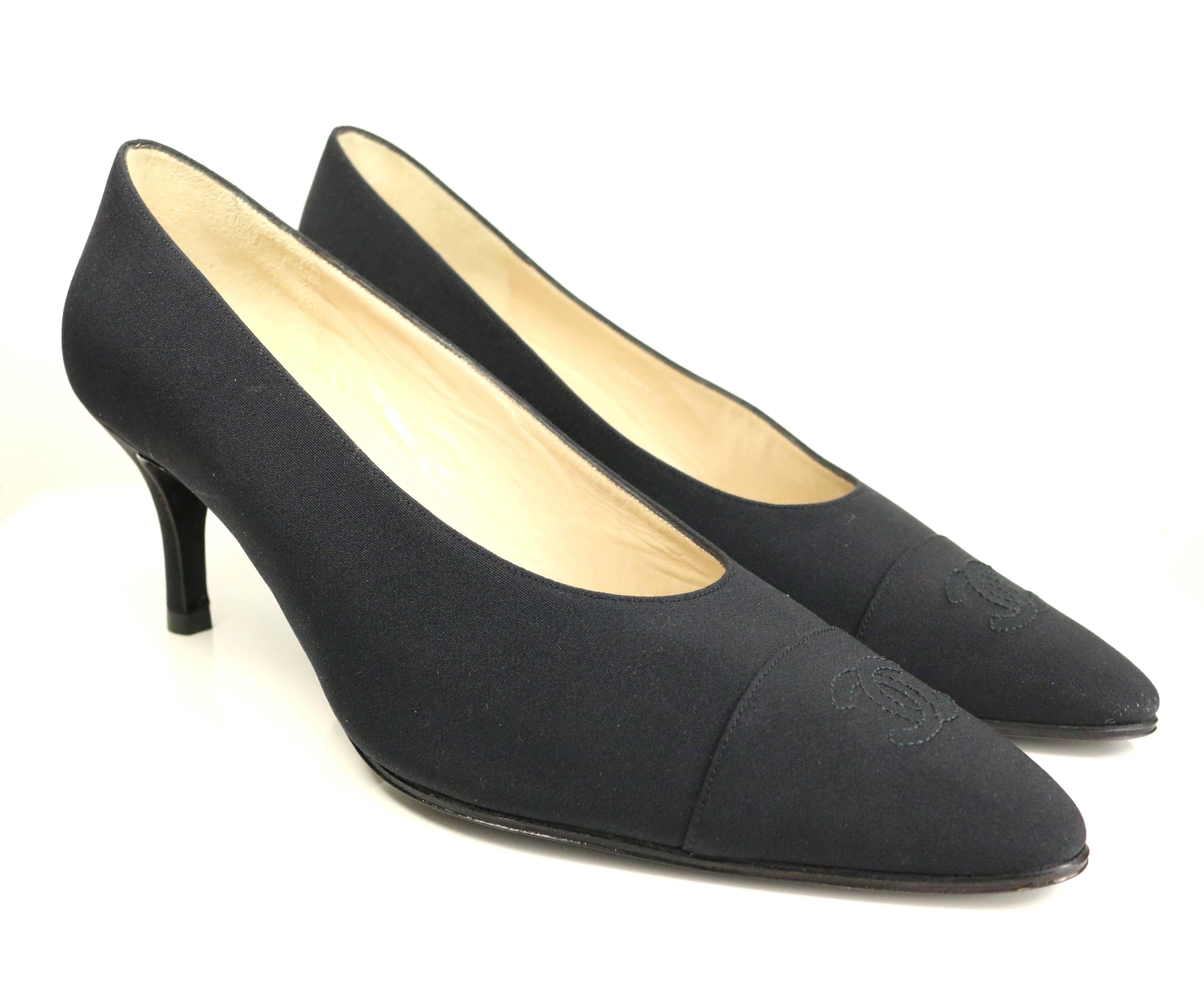 - Vintage 90s Chanel classic black silk heels shoes. Featuring a 