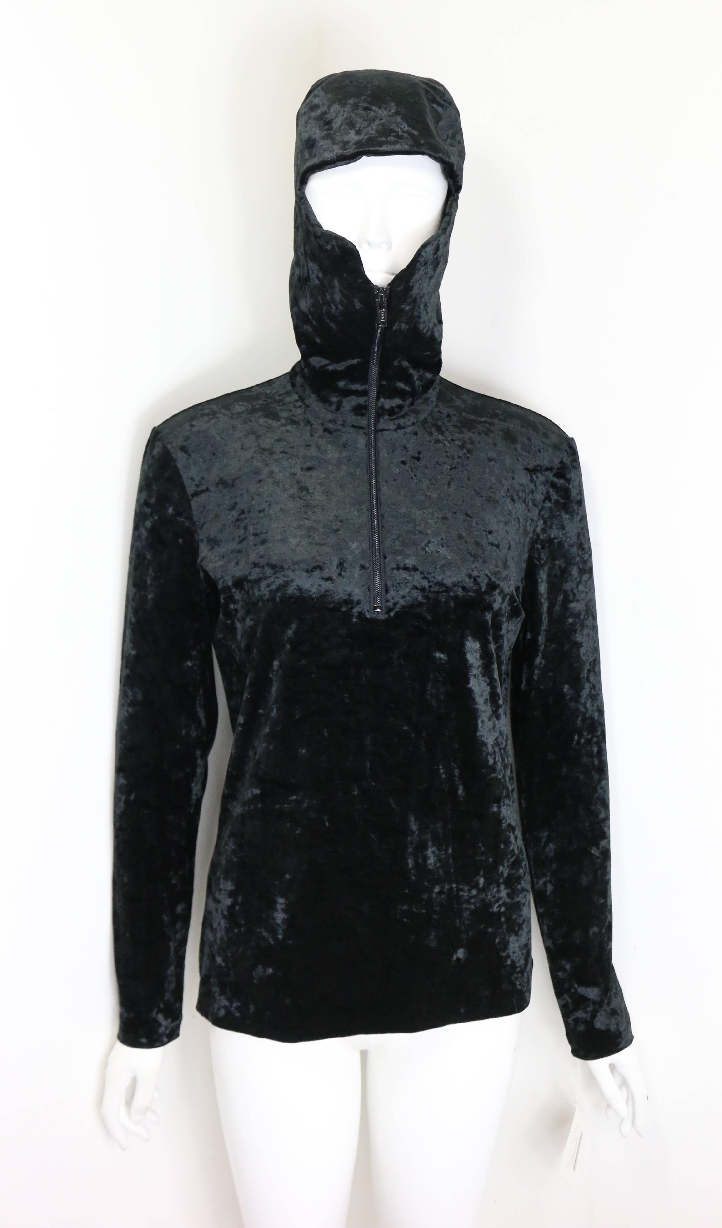 - Vintage 90s Issey Miyake black crush velvet zipper pullover sweater with hoodie. This hoodie top can be worn in different style. 

- Made in Japan. 

- Size M. 

- 60% Triacetate, 30% Nylon, 10% Polyurethane. 

- Shoulder: 14 inches. Bust: 32