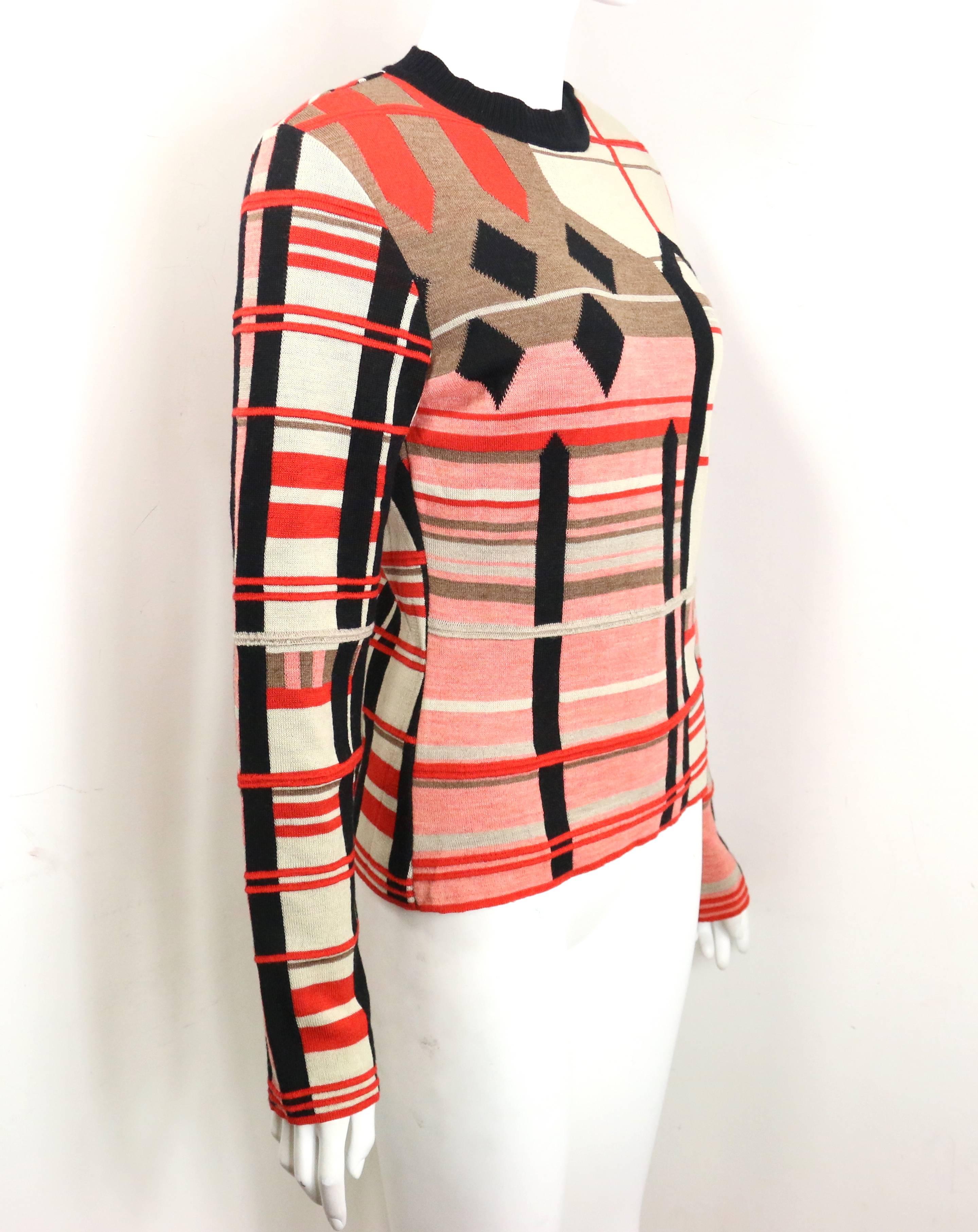 - Vintage 80s Bazar by Christian Lacroix colour blocked wool pullover sweater. Featuring three snap buttons closure on the left shoulder. 

- Made in France. 

- Size L. 

- Shoulder: 15 inches. Bust: 32 inches. Height: 23 inches. Sleeves: 26