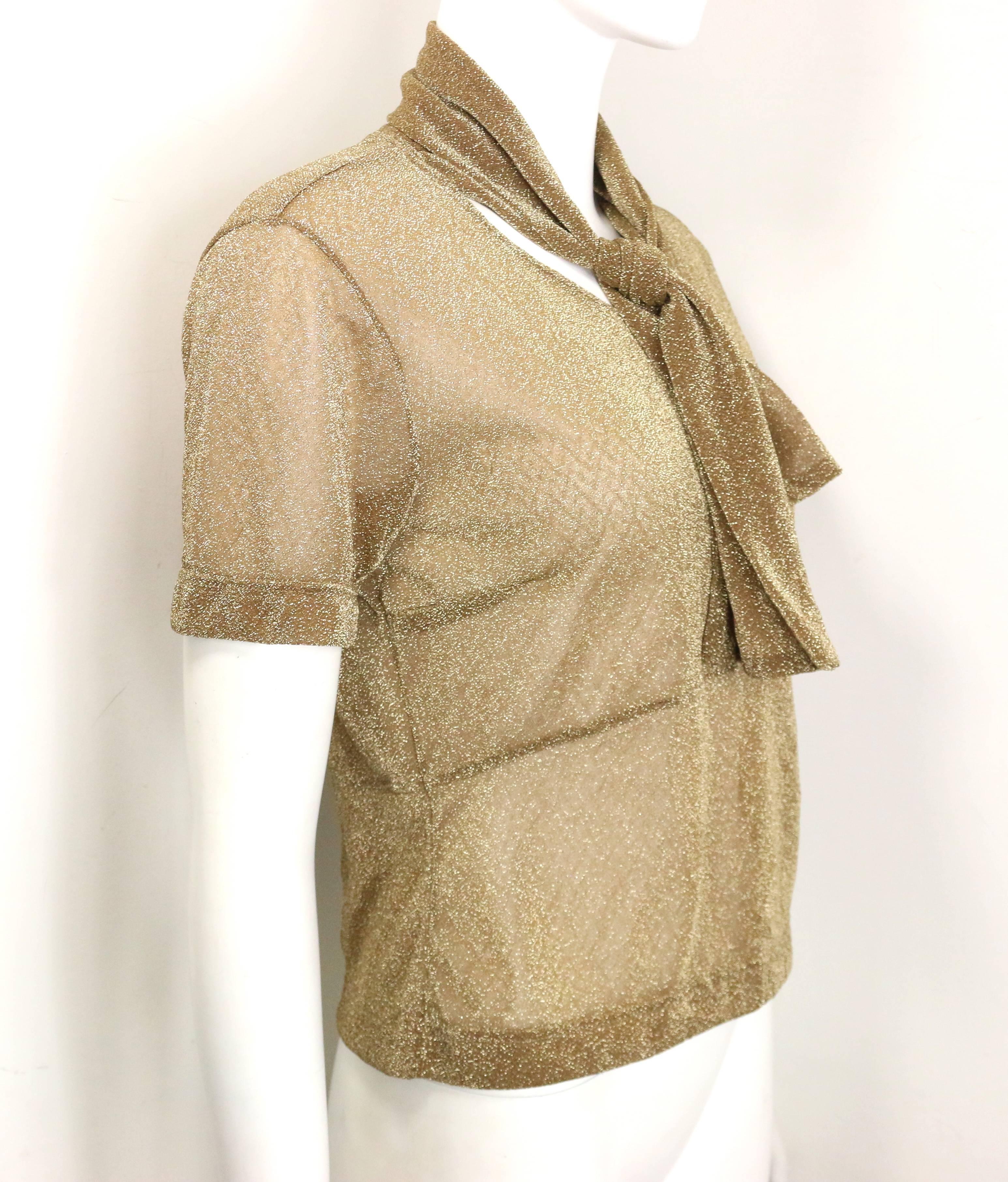 - Vintage 90s Dries Van Noten gold metallic cropped see through short sleeves blouse. Featuring same fabric attached to the neck.  A nice see through top with glitter and shiny all over!   

- Made in Belgium.   

- Size M.   

- 54% Polyester , 46%