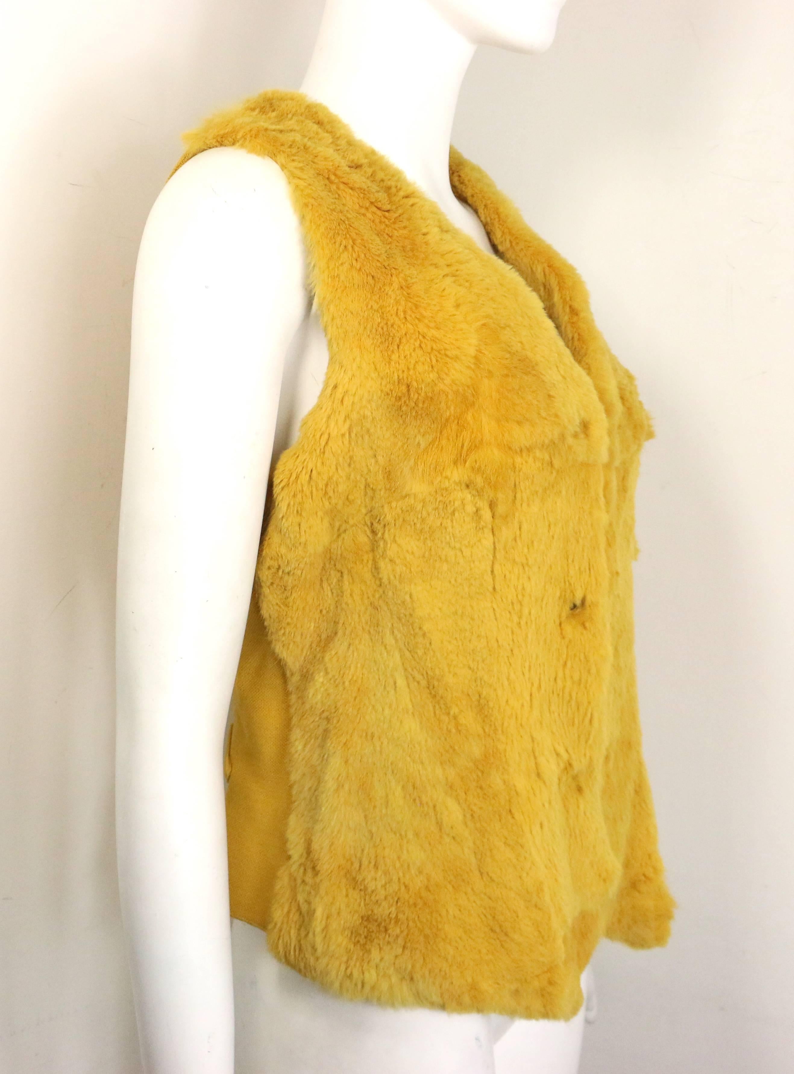 - Vintage Chanel yellow rabbit fur vest from 1997 A/W collection. Featuring a V neckline, a silver metal 