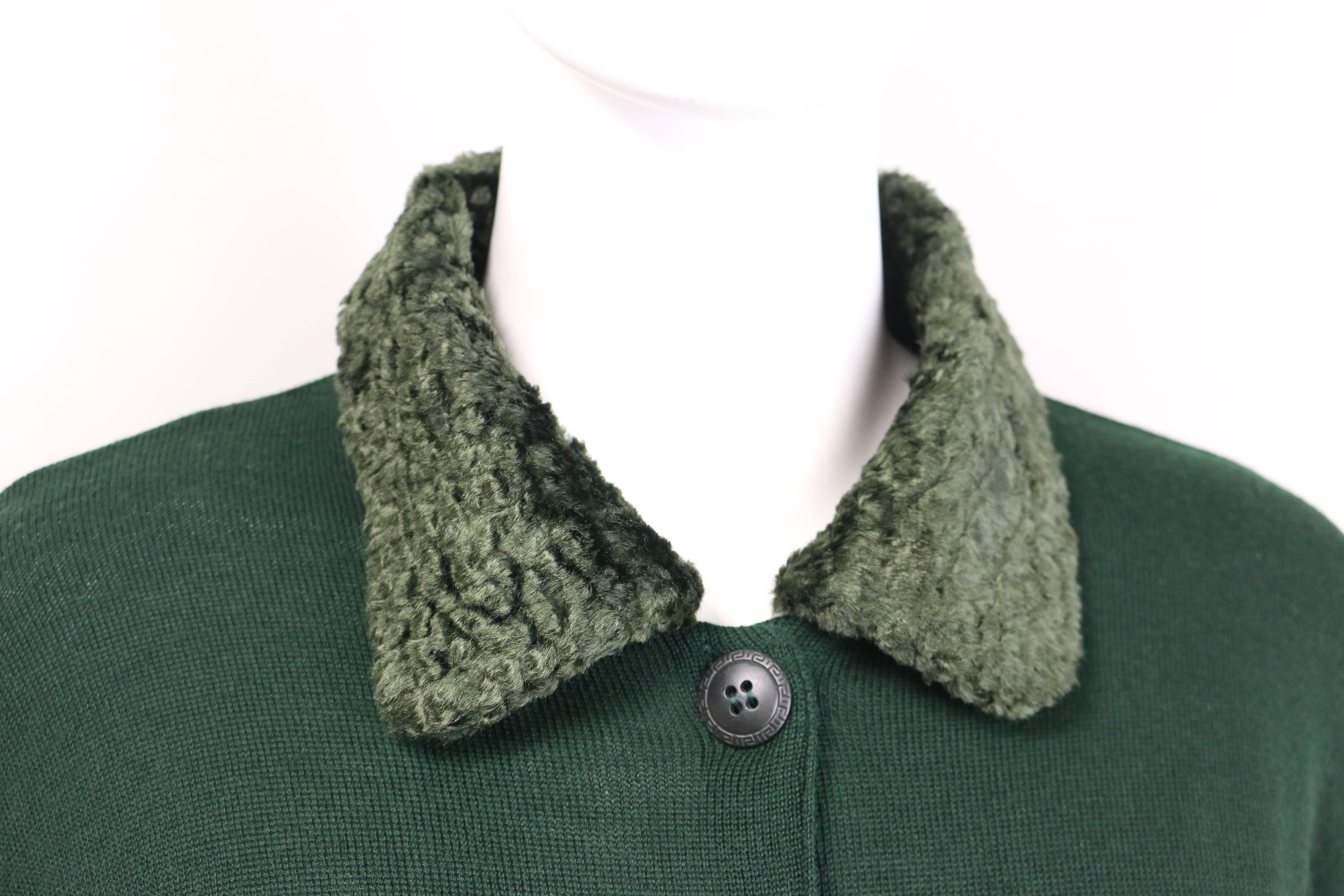 - Vintage 90s Gianni Versace Jeans Couture green wool cardigan. Featuring a green faux fur collar, five black metal hardware buttons closure, two welt pockets. A well made wool cardigan that is brand new with original tag attached. 

- Made in