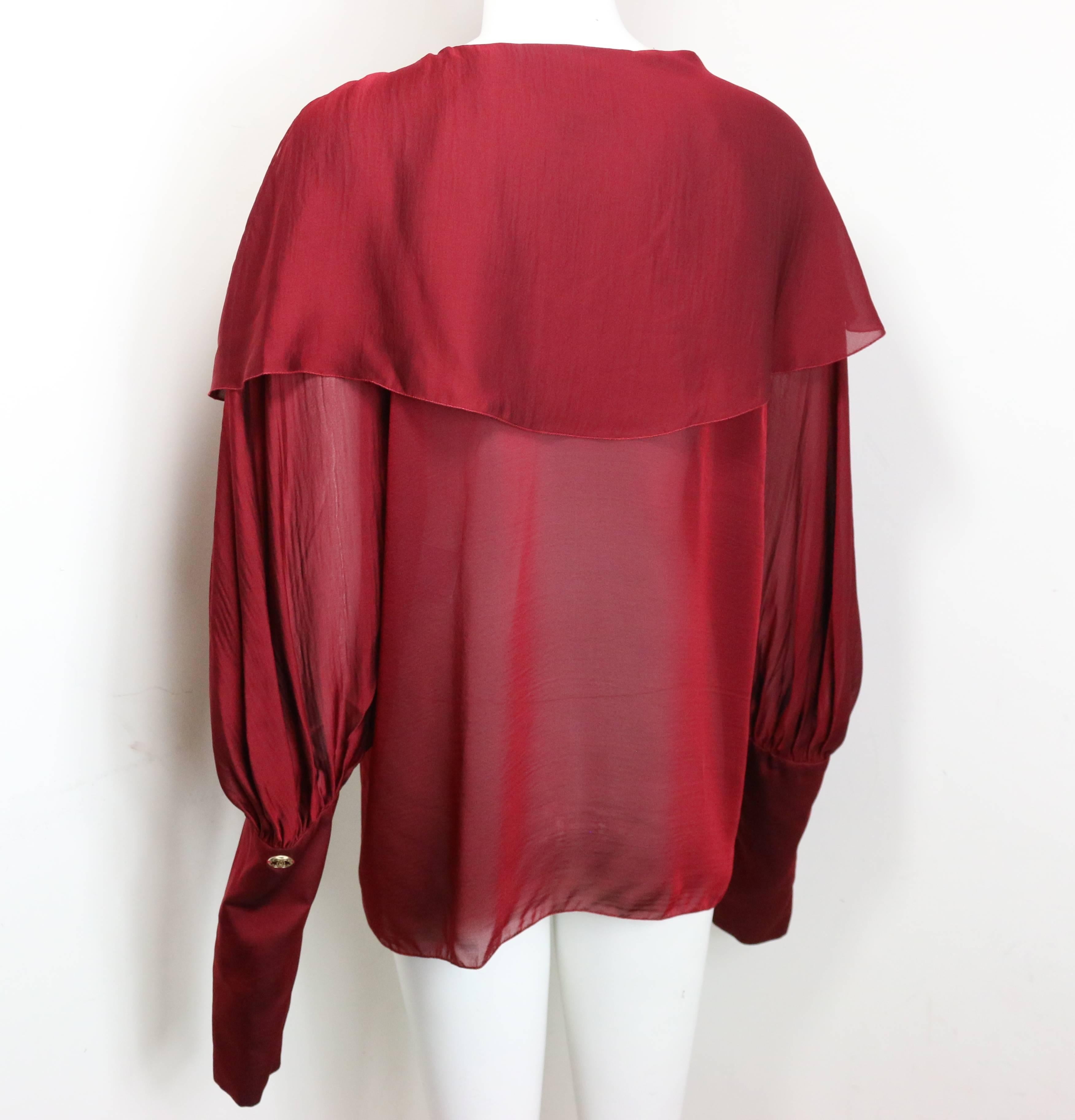 - Chanel red silk long sleeve victorian style long sleeves shirt from 2007 A/W collection. 

- Two silk layers. 

- Top three buttons closure. 

- Thirteen buttons closure on the sleeves. 

- Size 40. 

- 100% Silk. 


