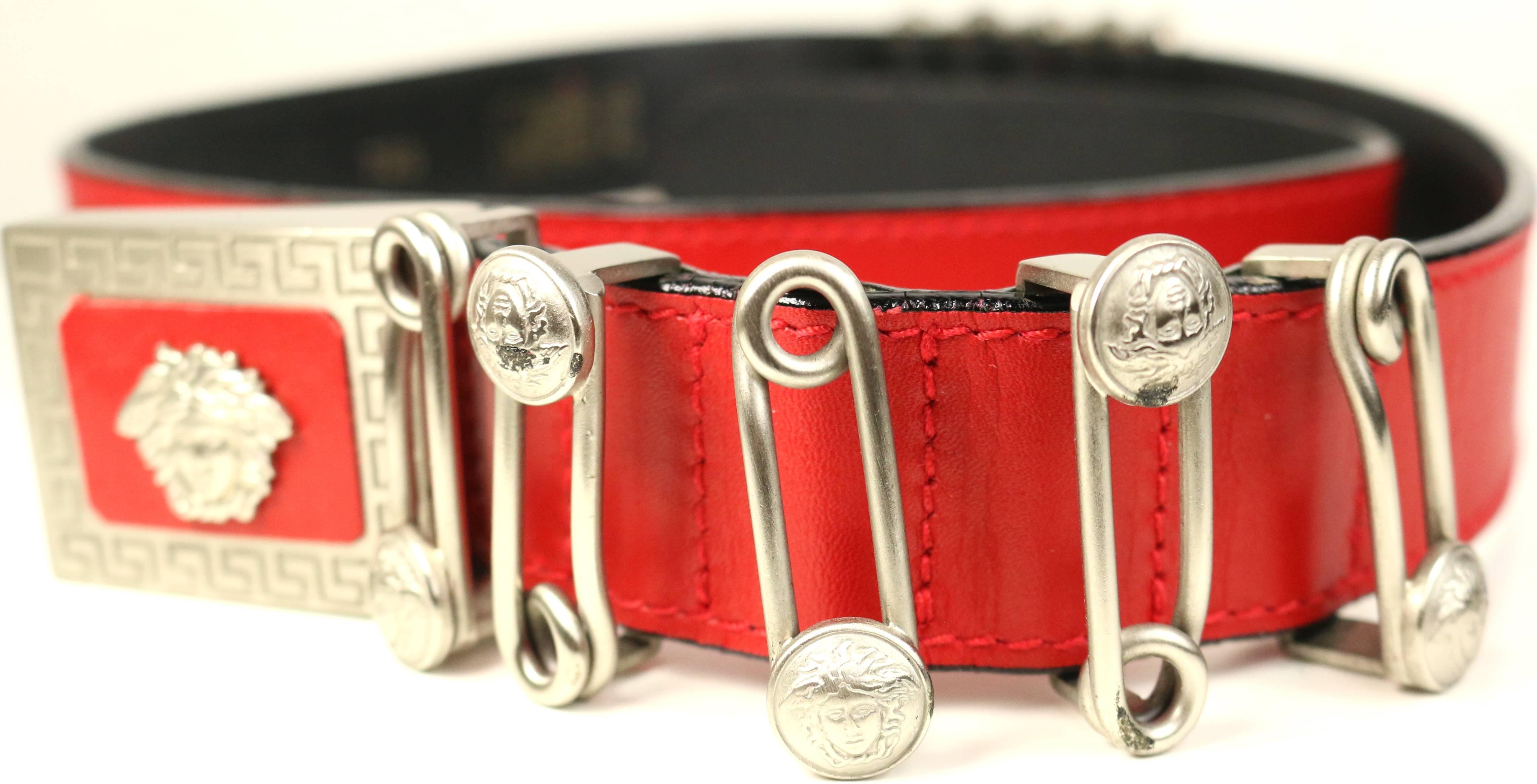 - Vintage 90s Gianni Versace red leather silver medusa pin belt. 

- Ten iconic sliver medusa pins. 

- Silver Medusa buckle closure. 

- Made in Italy. 

- Length: 35 inches. Width: 1.25 inches. 






