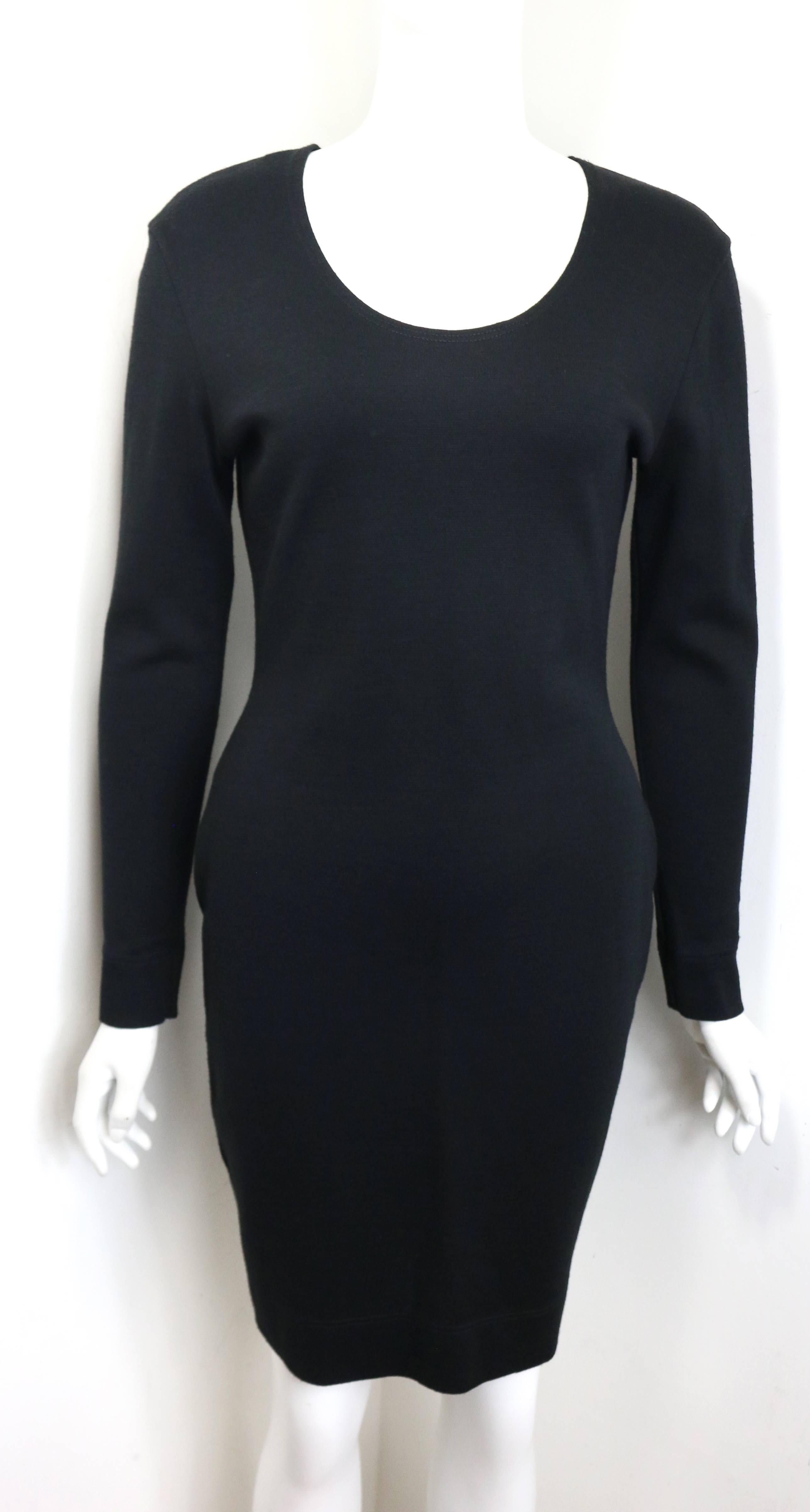 - Vintage 90s Cheap and Chic Moschino black wool dress. 

- Gold  