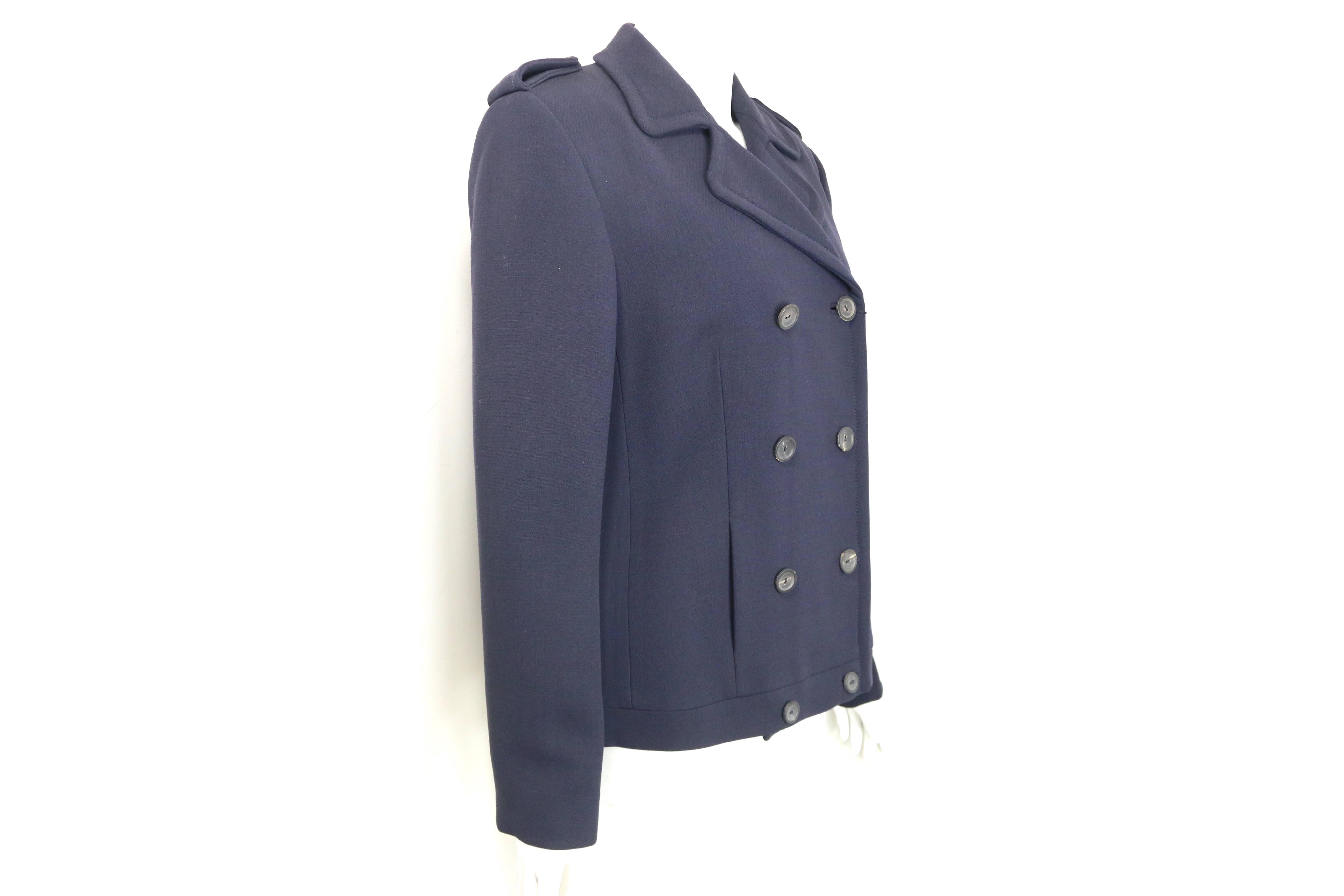 - Gucci by Tom Ford navy wool double breasted jacket from Fall 1996 collection. 

- Epaulette Shoulders. 

- Eight front buttons closure. 

- Size 44. 

- 100% Wool. 

