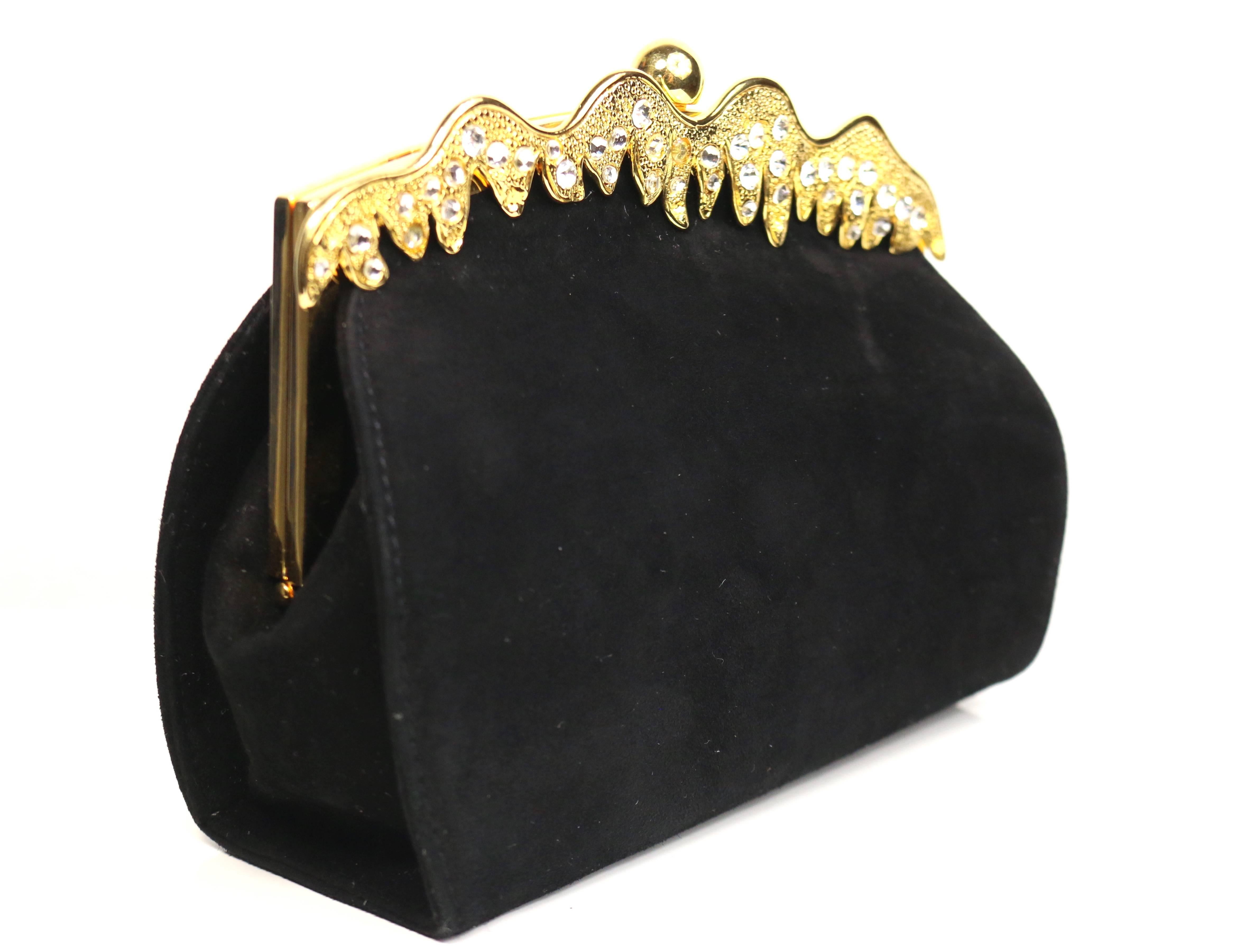- Vintage 80s Rodo black suede evening clutch/shoulder bag. 

- Featuring a gold toned irregular shape with crystal rhinestones. 

- Gold toned round shape kiss lock closure. 

- Detachable black leather shoulder strap. 

- Length: 6.5 inches.