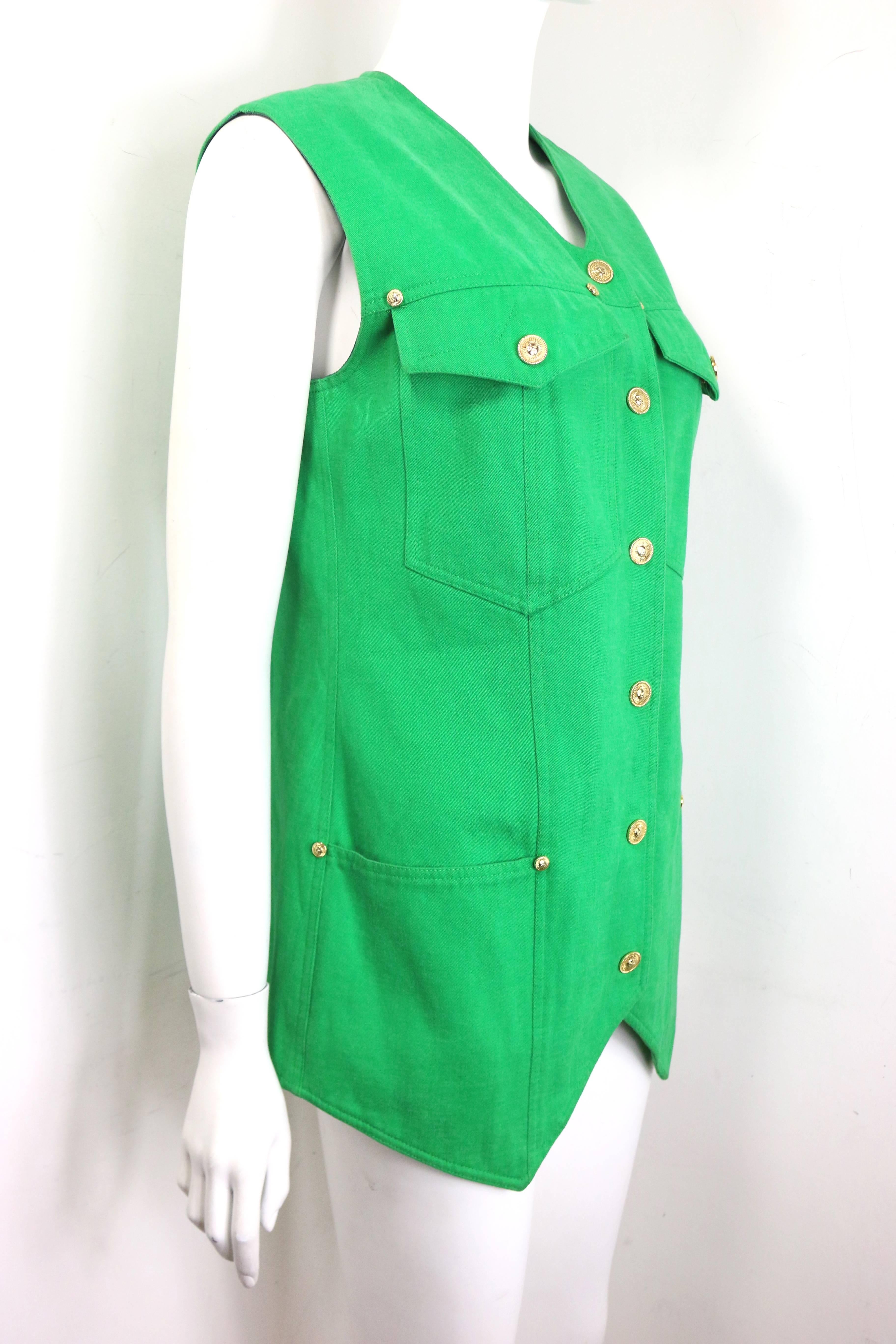 - Gianni Versace Jeans Couture green cotton collarless vest. 

- Embedded with gold toned hardware studs. 

- Gold toned hardware snap buttons closure. 

- Two front flap pockets with gold toned hardware buttons closure and two open pockets.

- Size