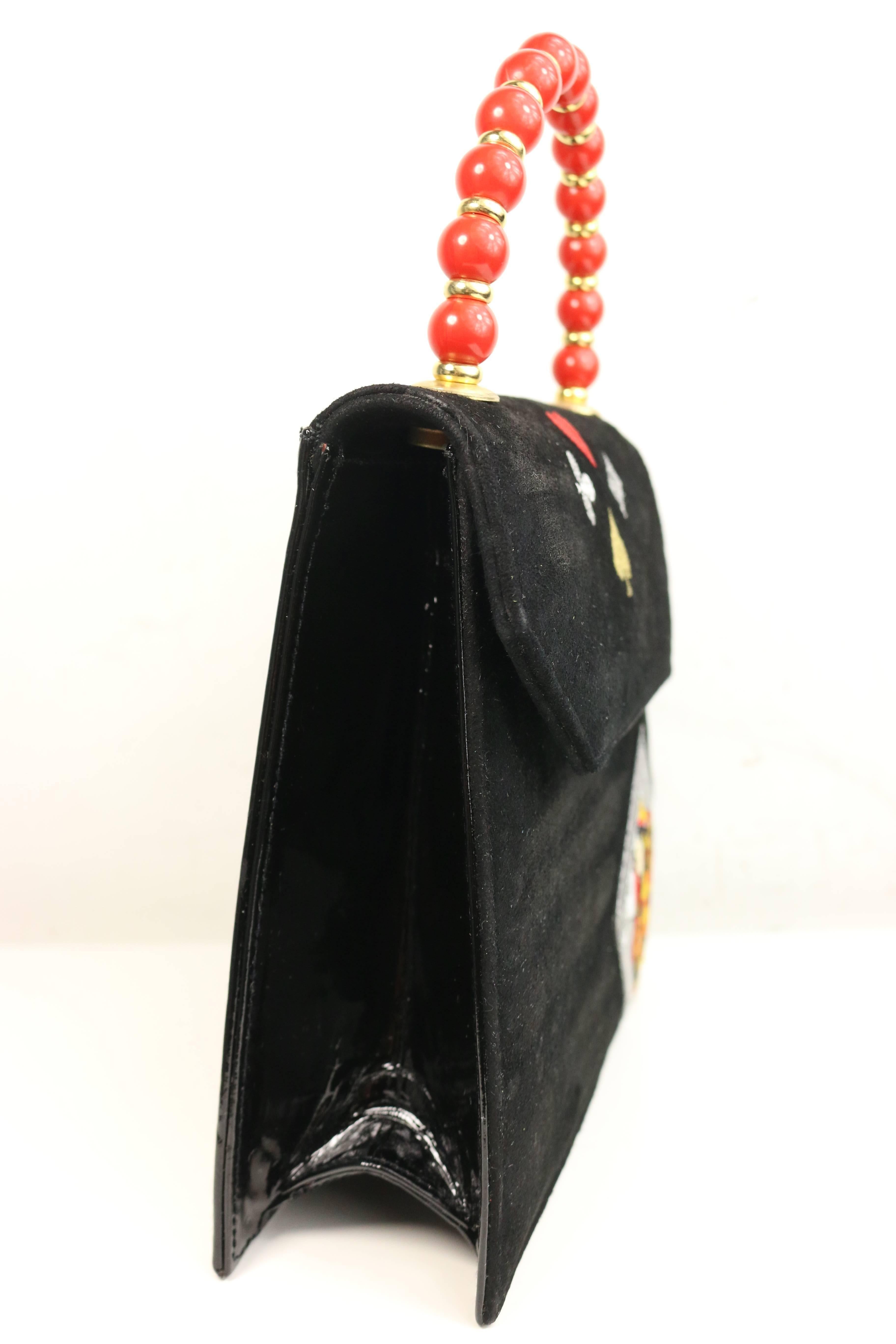 - Vintage 80s Beverly Feldman black suede front and suede side, back and base handbag. 

- Featuring embroidered four symbols which is heart, diamond, spade and club. Also, an embroidered Queen of cards. 

-  Featuring red stone and gold toned