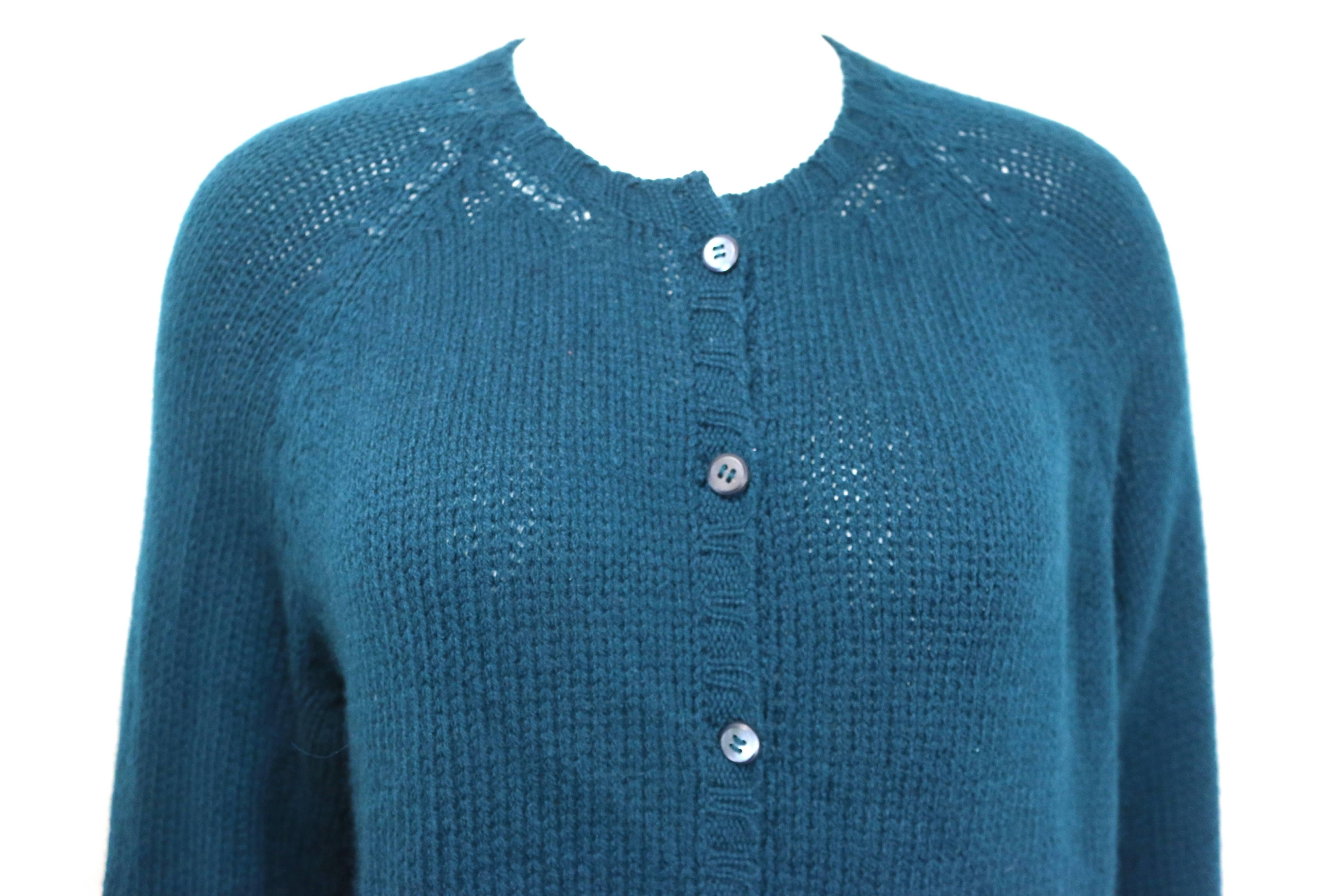 - Vintage 90s Prada teal cashmere cardigan.  

- Mother of Pearl buttons closure. 

- Size 46. 

- 100% Cashmere